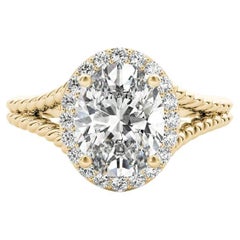 GIA 1,01 quilates Anillo de diamantes de oro amarillo de 18 quilates con aureola ovalada y mango dividido en cuerda trenzada