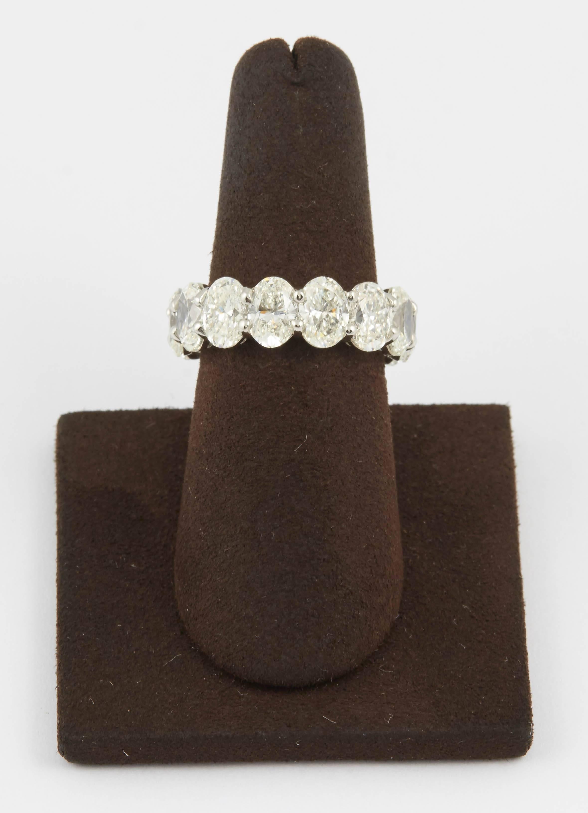 
A beautiful eternity band -- each diamond averages over 3/4 carat.

10.92 carats of white oval cut diamonds set in a custom made platinum mounting.

The finger size is 6.5, and can be adjusted.  
