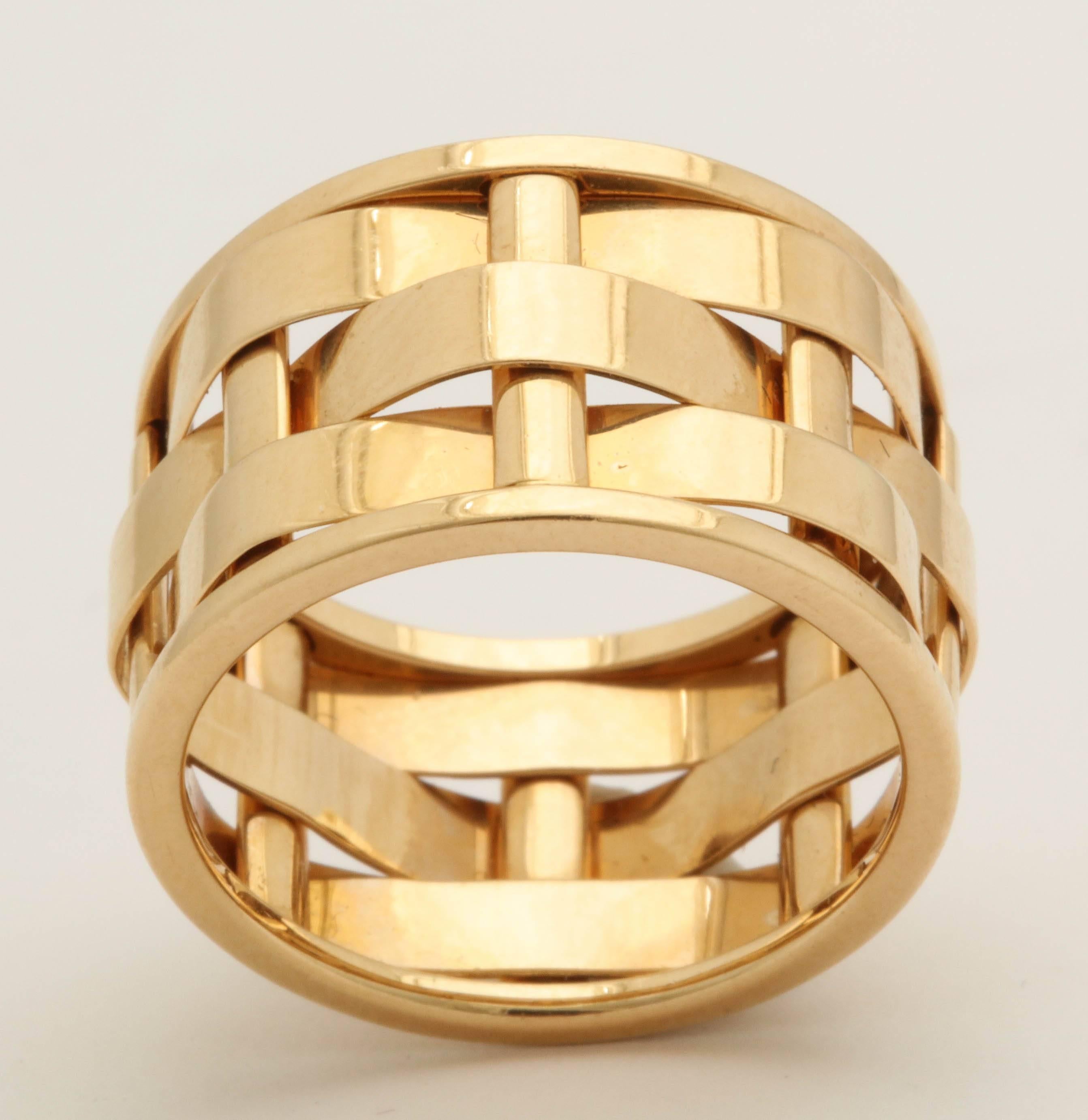 One 18kt Gold Band Ring Exhibiting An Open Link Basket Weave Design ,Created By Ralph Lauren. Original List Retail Price Was 3500.00 Note: With Original price tag still on the ring.Very Chic And Classic Ralph Lauren Design.Ring Size 6.