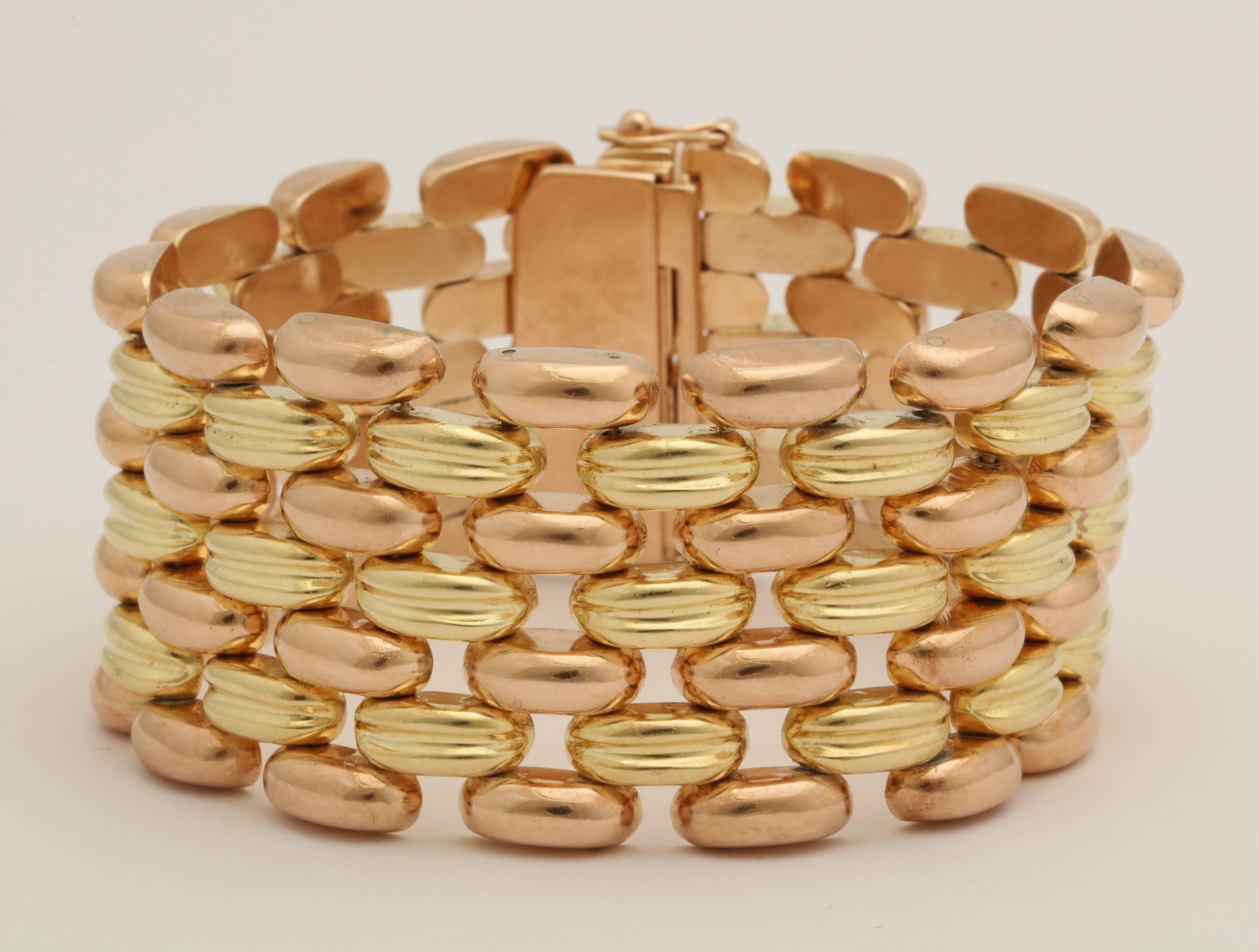 One 18kt Yellow Gold And Pink Gold Chic Two Tone Bracelet Consisting Of Five Rows Of Curved Links. Made In America In The 1950's.