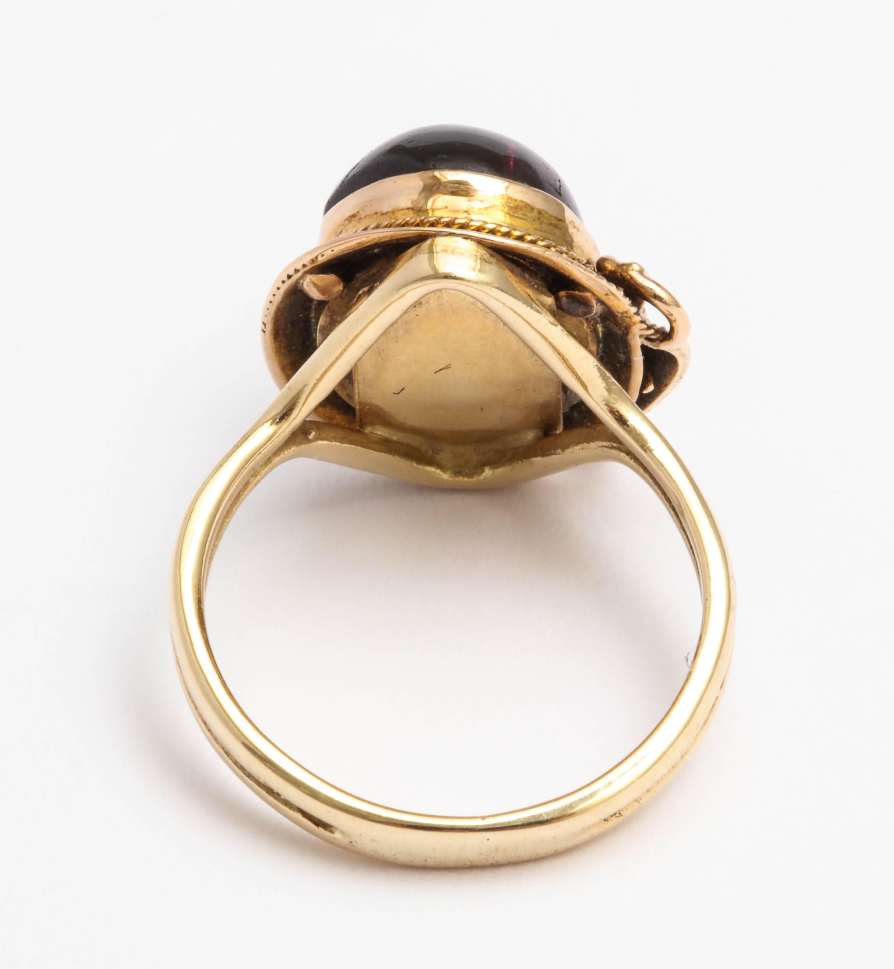 Late Victorian English Cabochon Garnet Gold Buckle Ring, circa 1880
