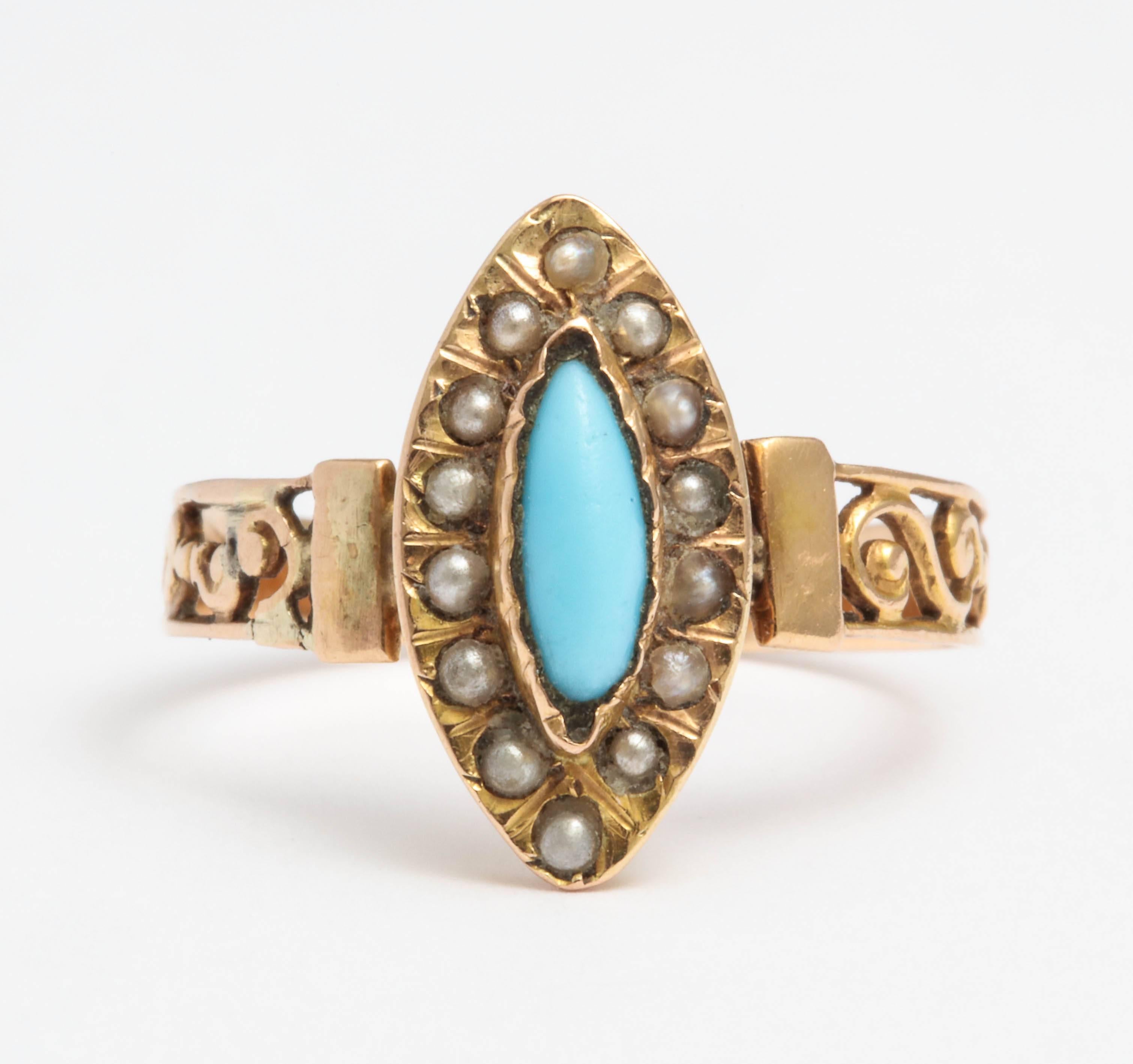 A beautiful French navette-shaped ring bezel-set with a oval cabochon turquoise surrounded by fourteen seed pearls, with openwork scrolling shoulders in 18k rose gold.

Paris, 19th century, with French hallmark

Size 6 1/2
