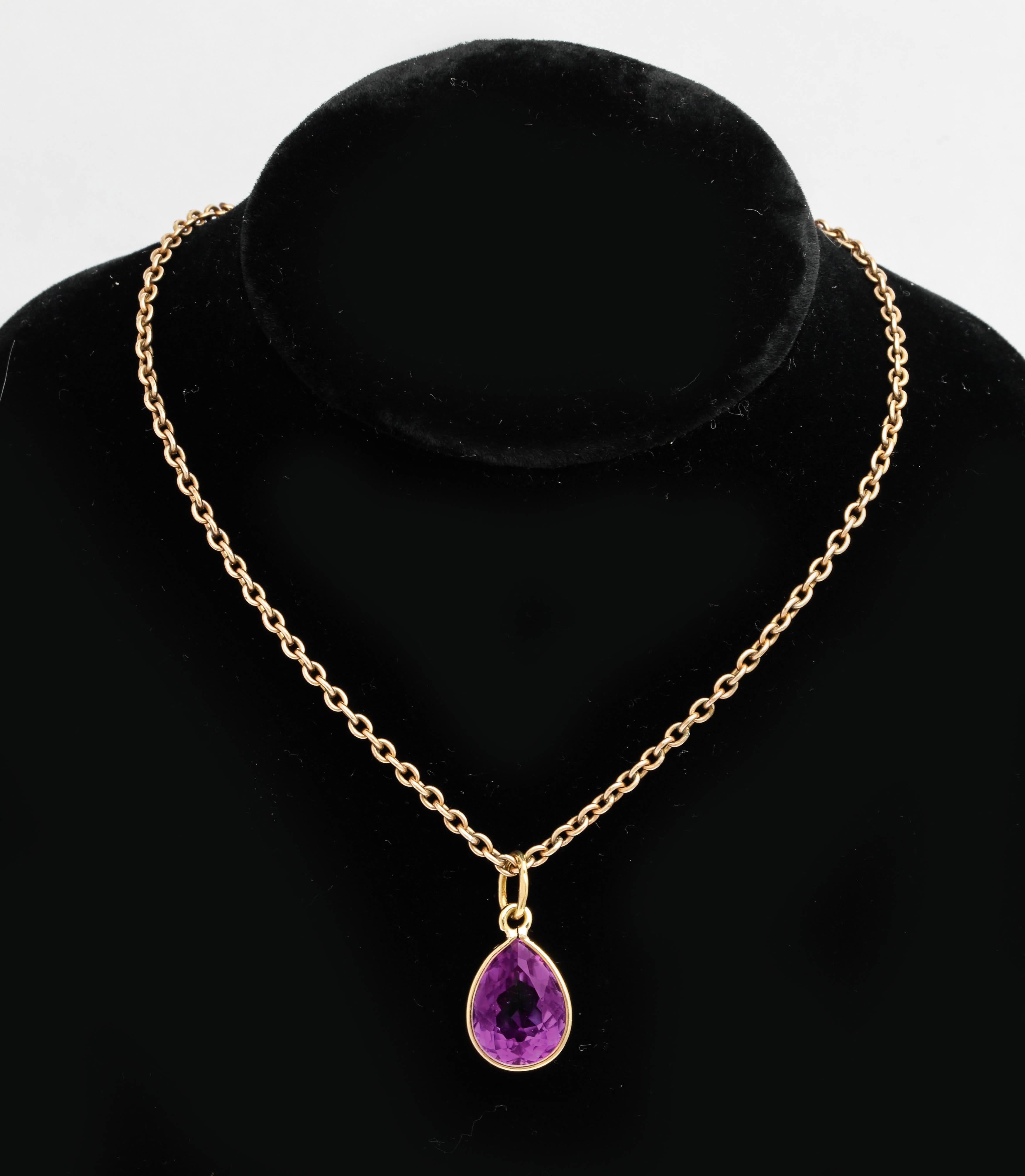 A beautiful amethyst 18k yellow gold pendant set with a tear drop shaped faceted amethyst of deep violet color, bezel set in 18k yellow gold with large suspension ring to accommodate most chains.

Stamped 750, 20th century. 

1 in. (2.5 cm) long