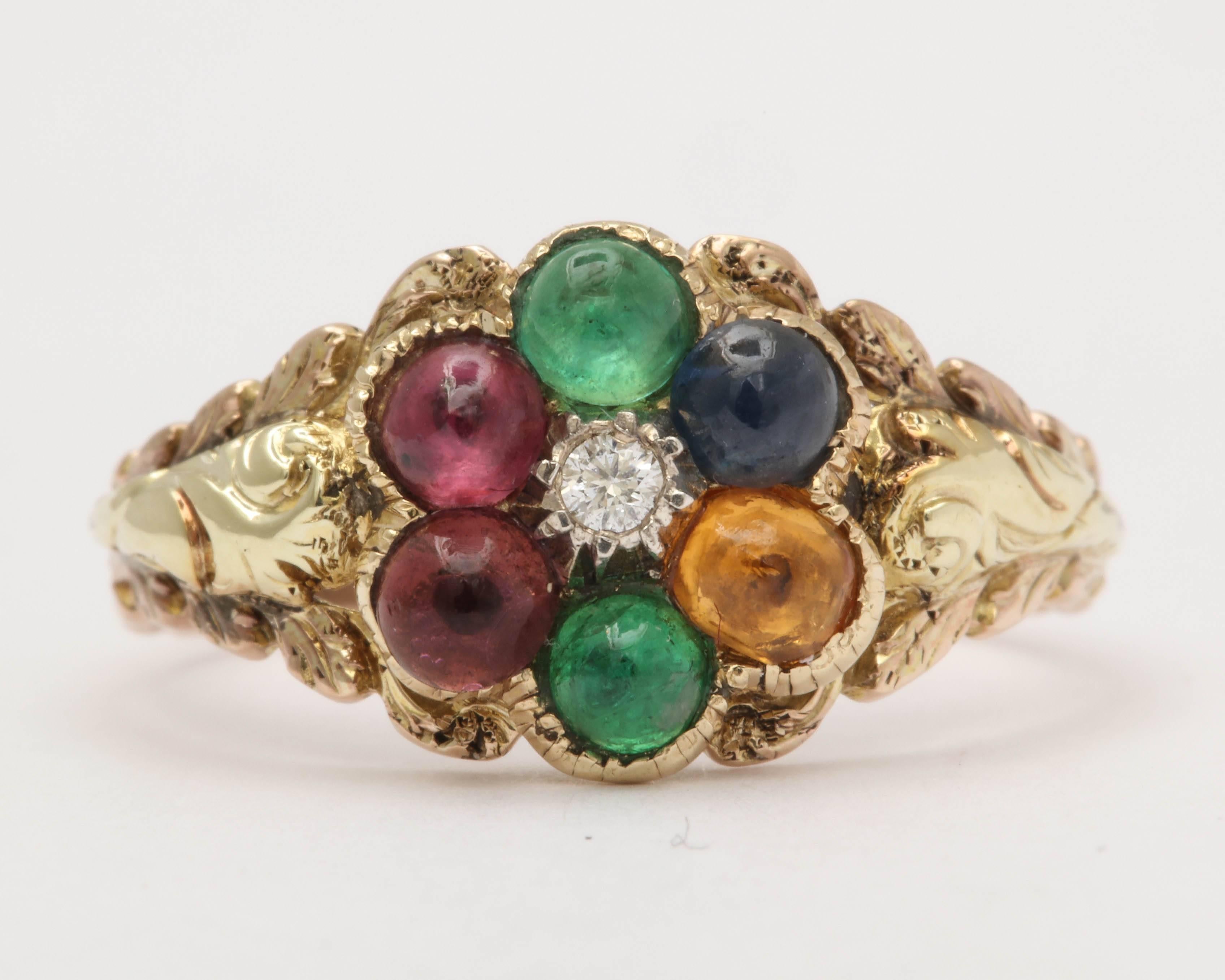 The absolute best of its kind-cabochon stones with diamond center cluster. The stones spell out the word dearest using a diamond, emerald, amethyst, ruby, emerald, sapphire, and tourmaline. The ring has a locket back which would have likely held