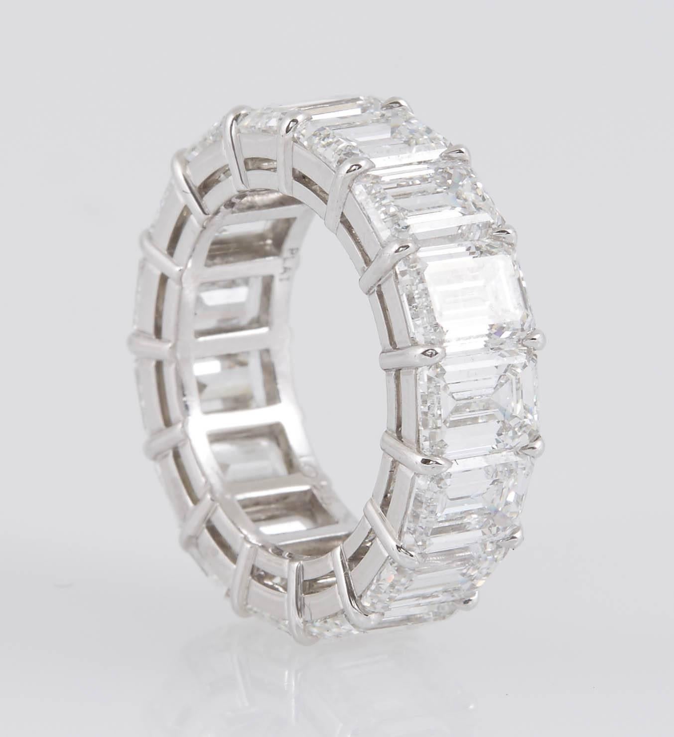 Signed GRAFF Eternity Wedding Band finely crafted in platinum with 15 emerald cut diamonds, weighing a total of approx. 10.96 carats.