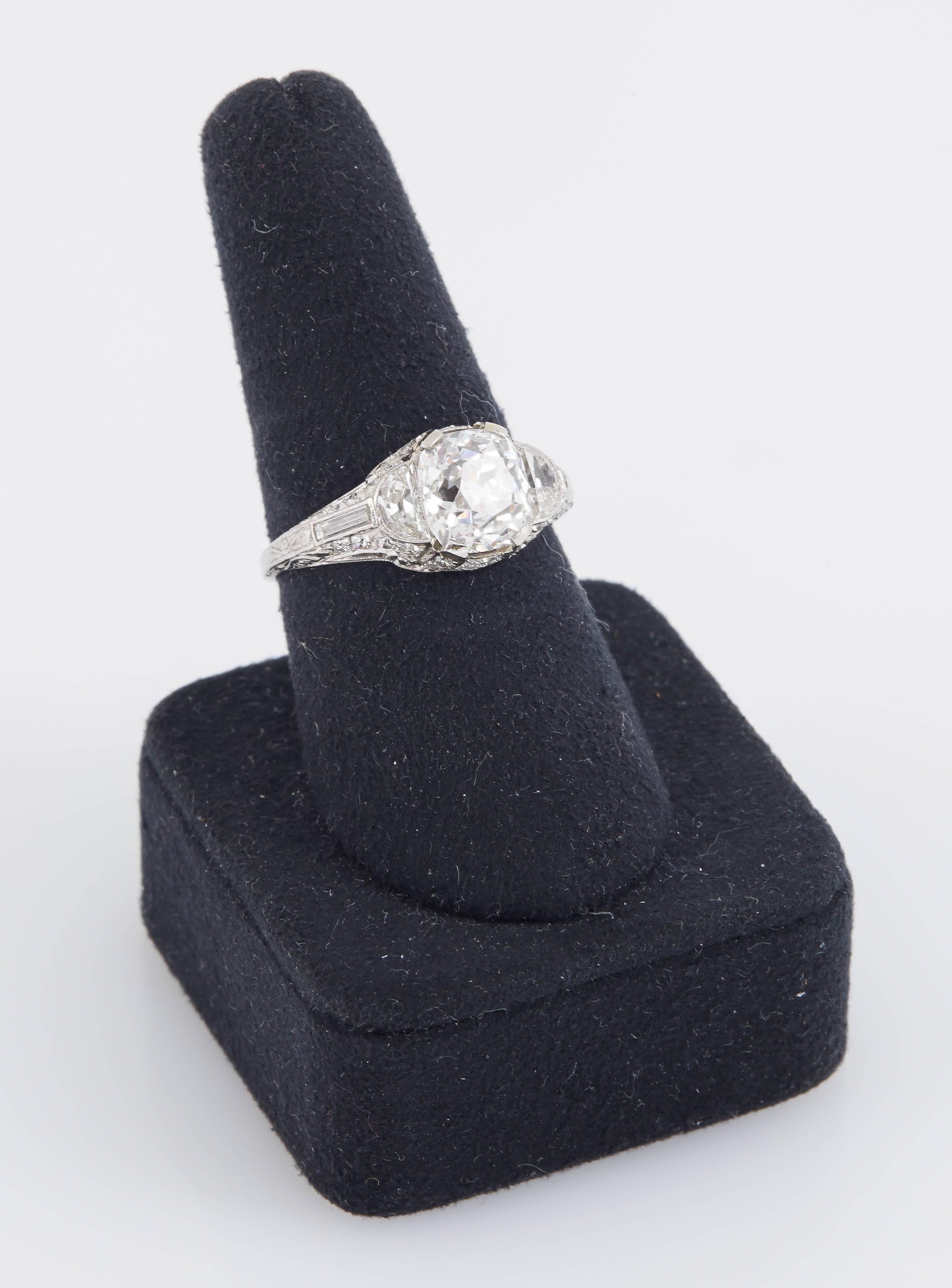 Antique Art Deco engagement ring finely crafted in platinum with GIA certified Old Mine Cushion cut diamond at the center weighing 3.00 carat, D color VS1 clarity. 
