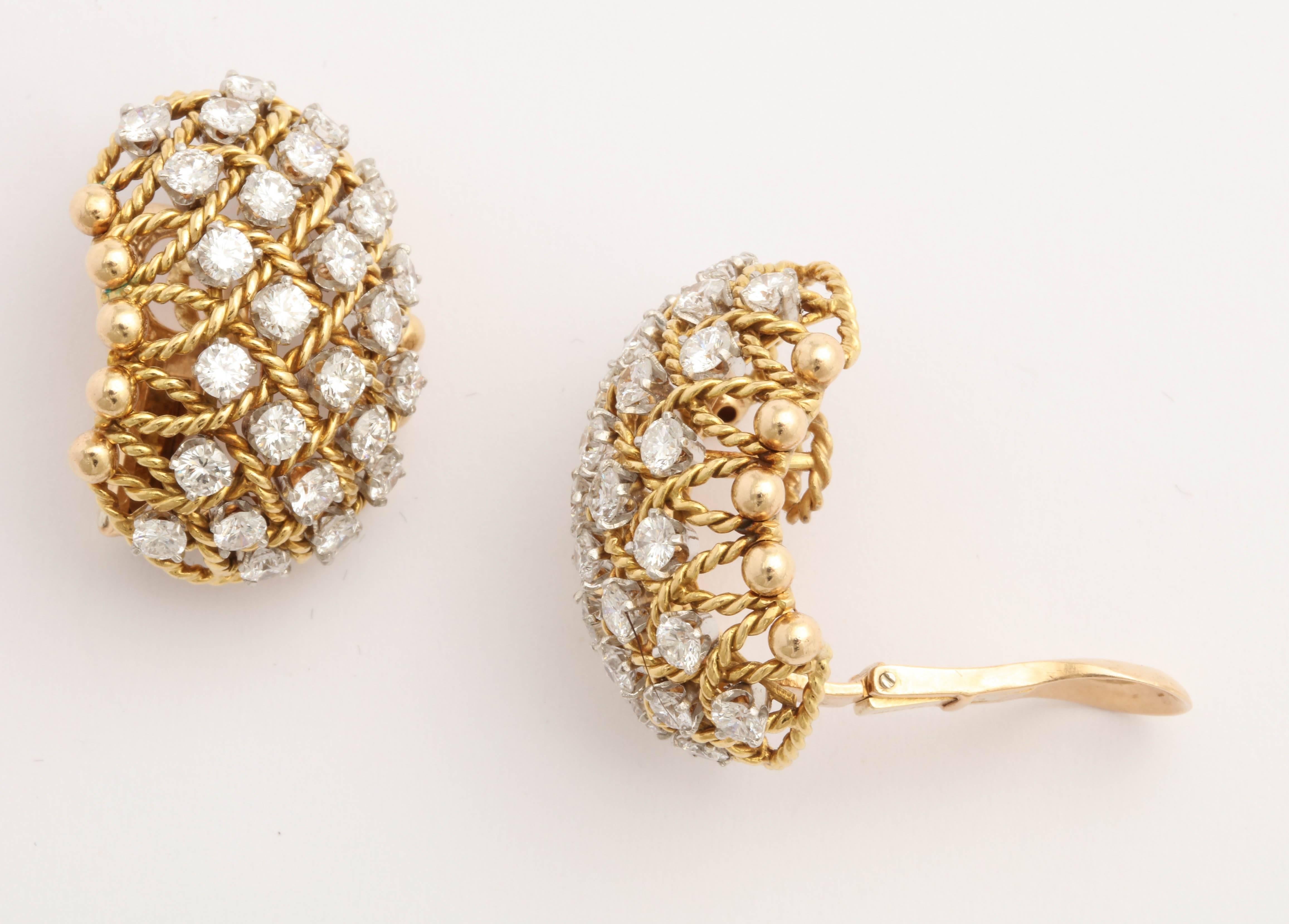 French 18kt Yellow Gold  Basket Earrings set with 56 full cut clean white diamonds set in between a basket weave motif.   Diamonds weighing approximately 6 carats total.  1980's. 