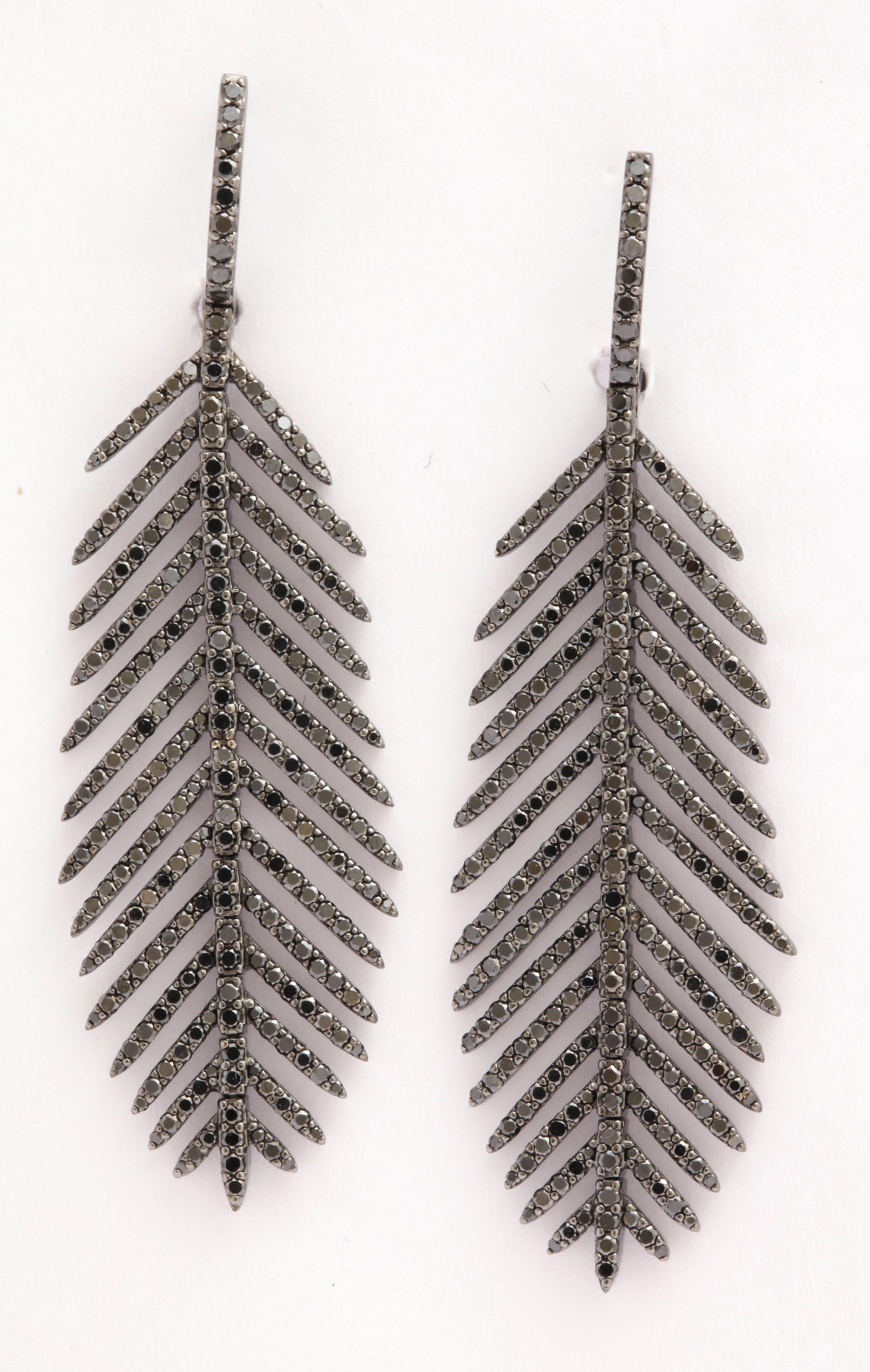 !8kt Black Rhodium plated Articulated Feather Earrings set with black Diamonds.  Apprise 2.5cts total
