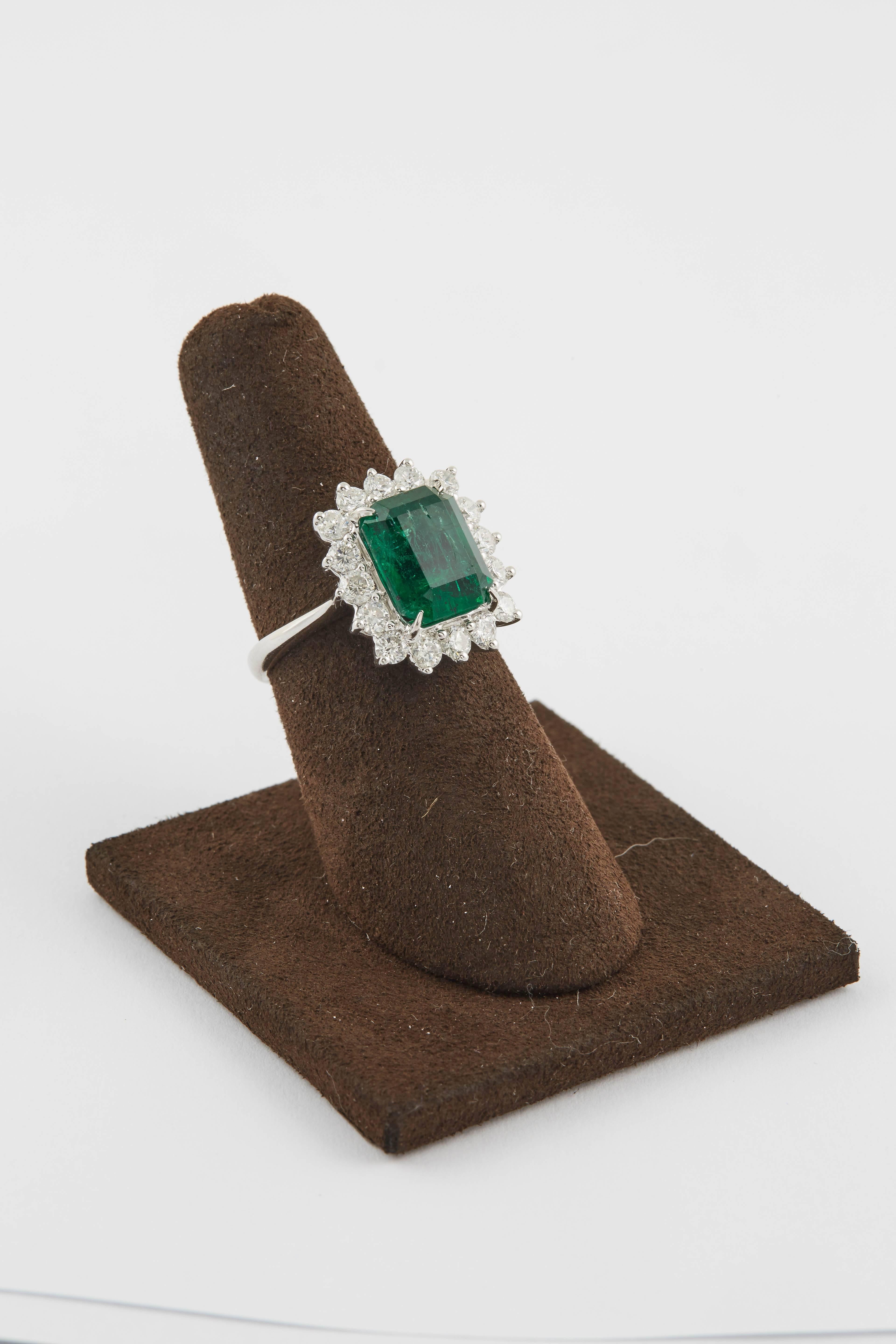 

A beautiful ring!

4.20 carat center Green Emerald with fine color.

1.19 carats of round brilliant cut diamonds, F/G VS.

18k white gold

The ring is currently a size 6.5 but can be sized to any finger size. 

