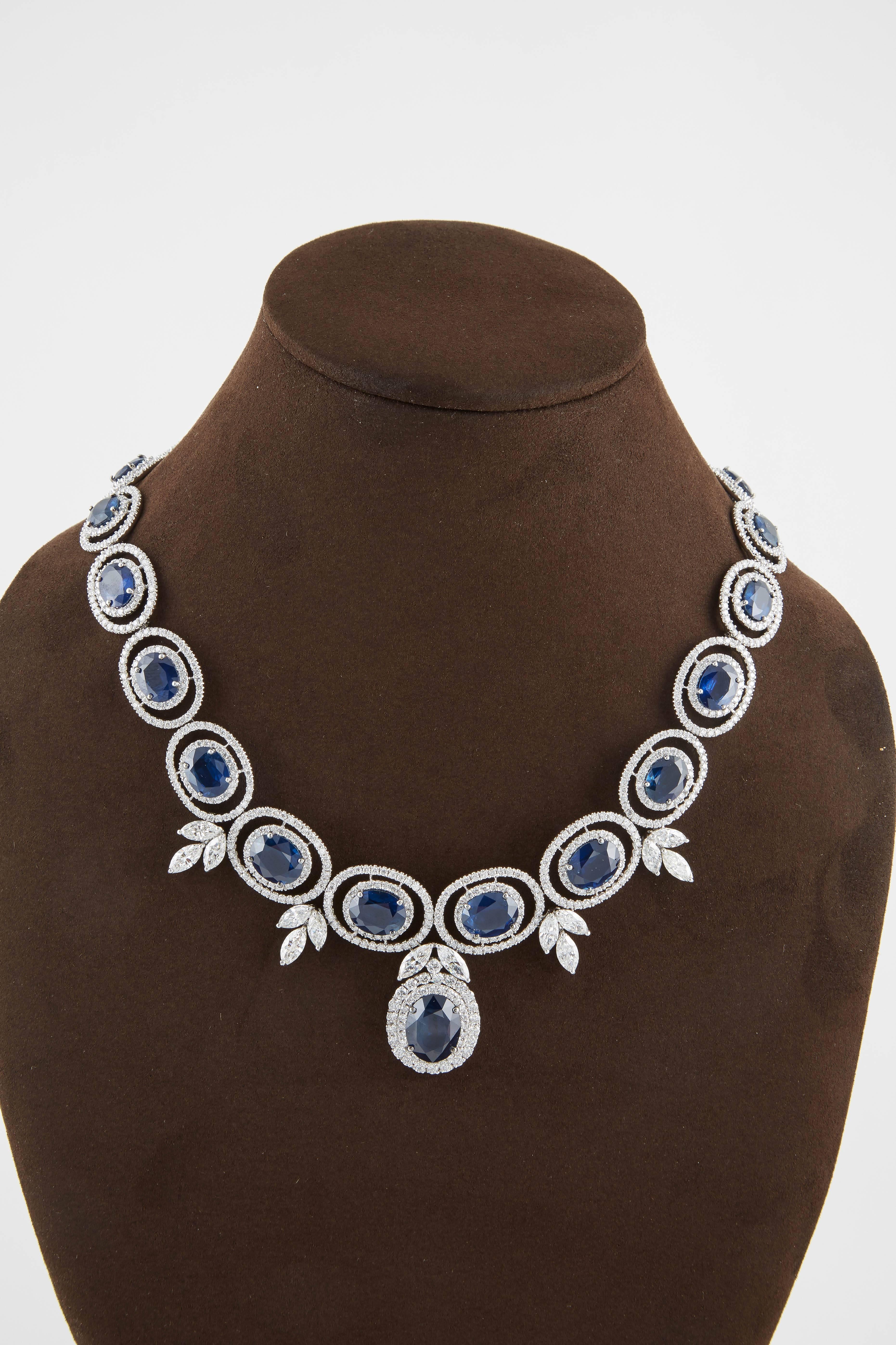 

A beautiful sapphire and diamond necklace.

57.67 carats of fine blue oval sapphires.

24.92 carats of white round and marquise cut diamonds.

18k white gold 

16.25 inch neck length, but can be adjusted. 

A spectacular piece!!

