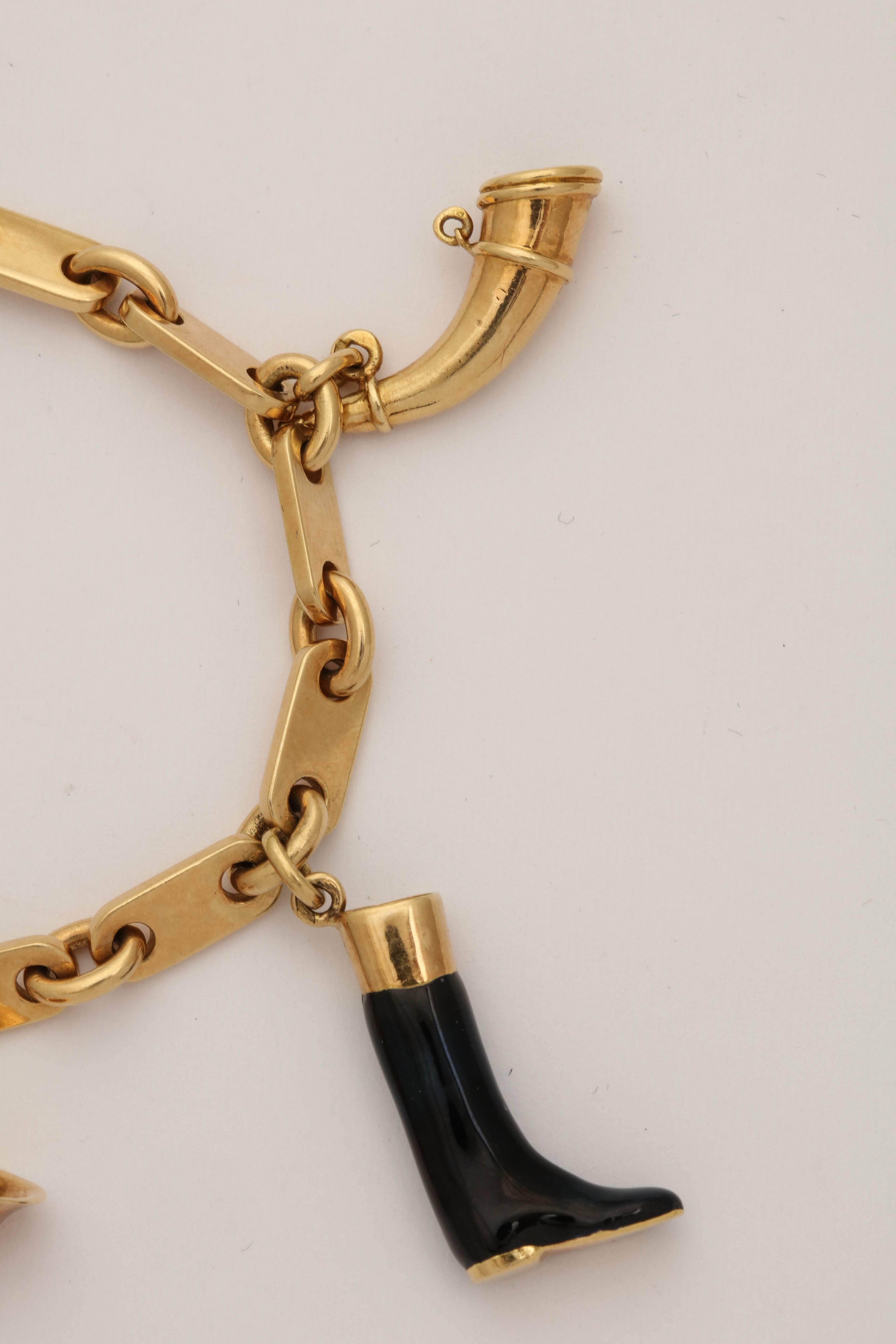 1950s Hermes Paris Equestrian Five-Charm Black Enamel Gold Bracelet In Good Condition In New York, NY