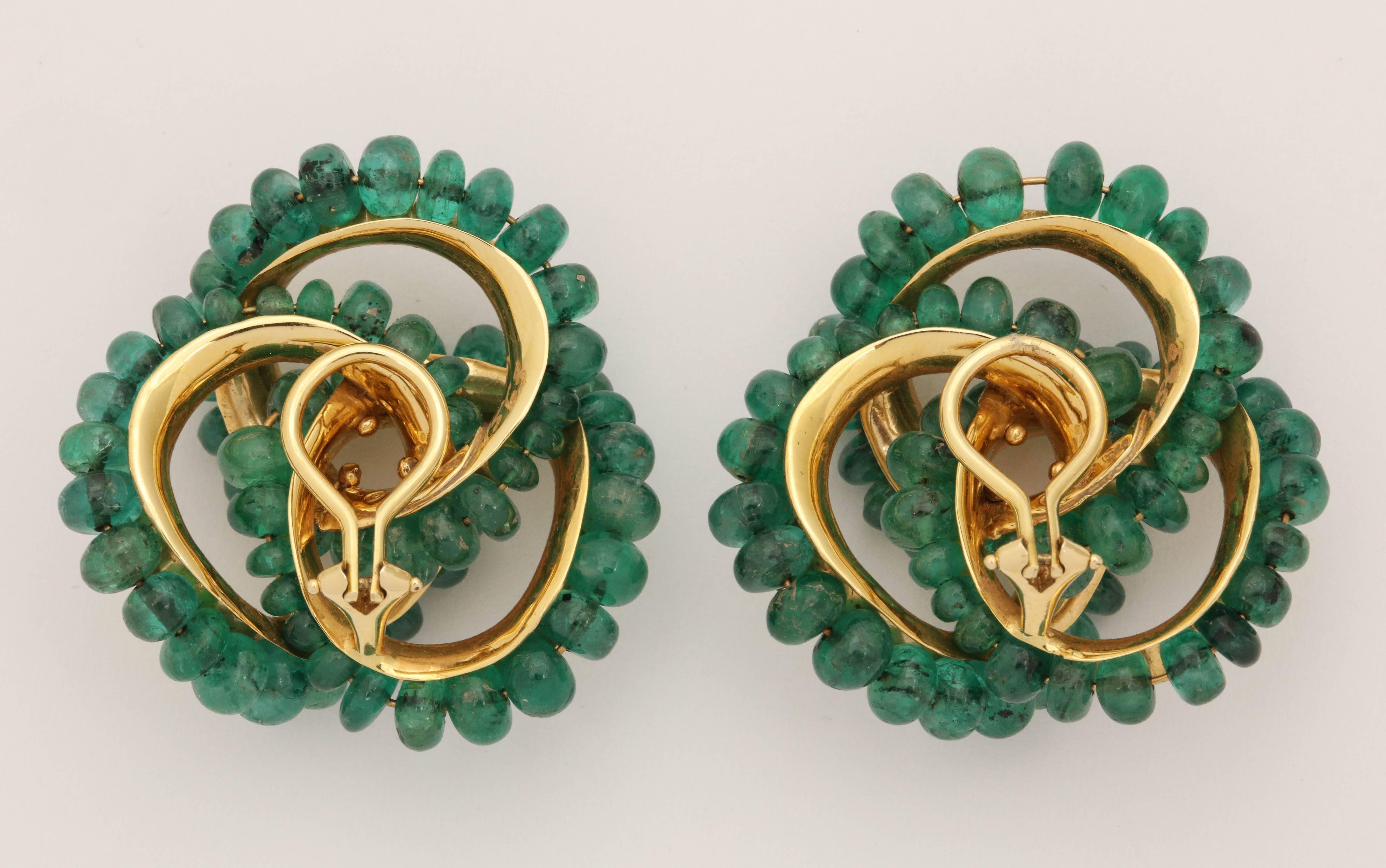 Women's 1980s Seaman Schepps Large Emerald Pretzel Knot Design Gold Clip-On Earrings
