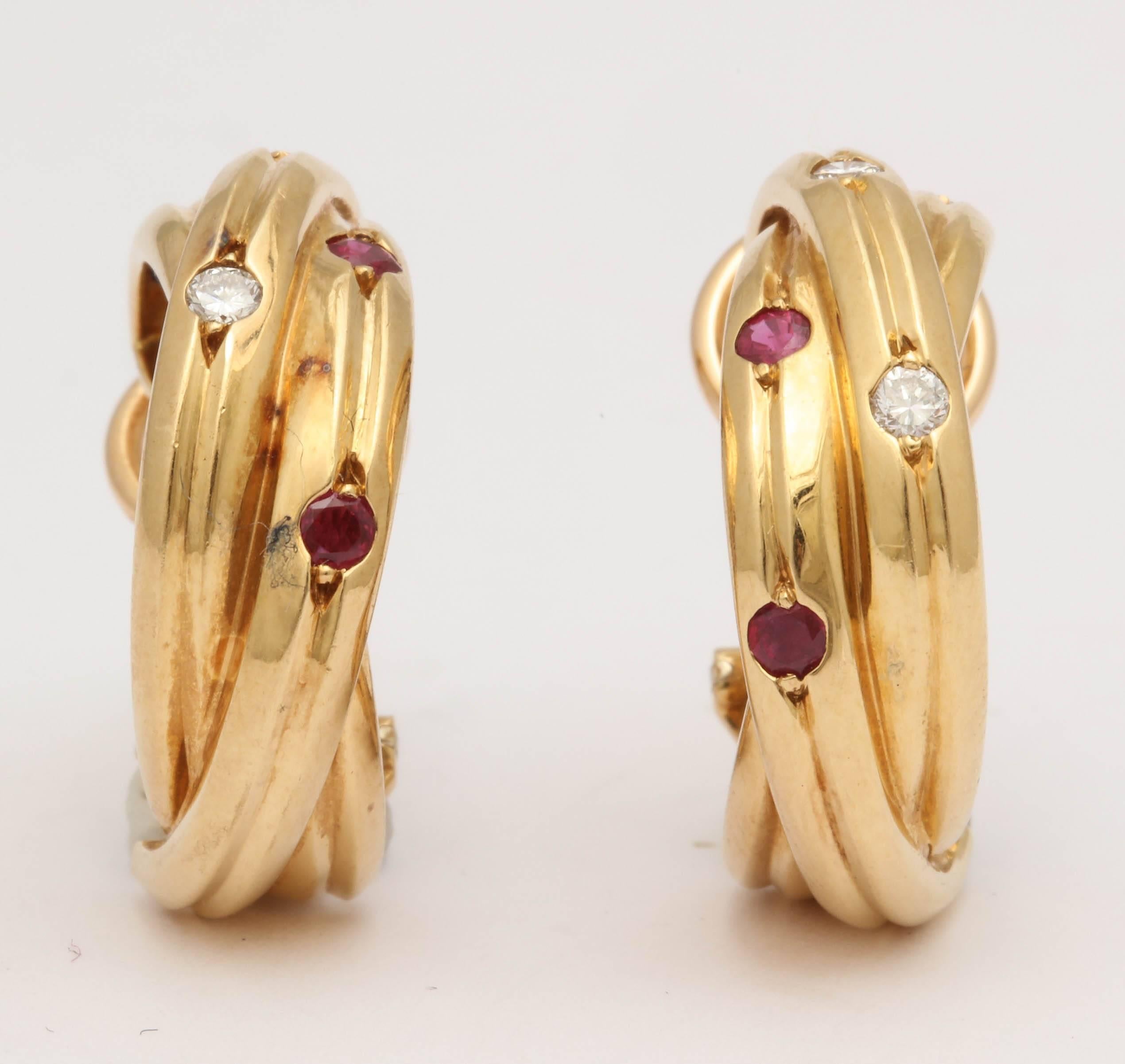 One Pair Of Ladies Triple Hoop Rolling Ring Earclips With Posts Embellished With Four Full cut Diamonds And With Four Faceted Cut Beautiful Color Rubies And Two Beautiful Color Faceted Cut sapphires.NOTE: Posts May Be Removed For Non-Pierced Ears.