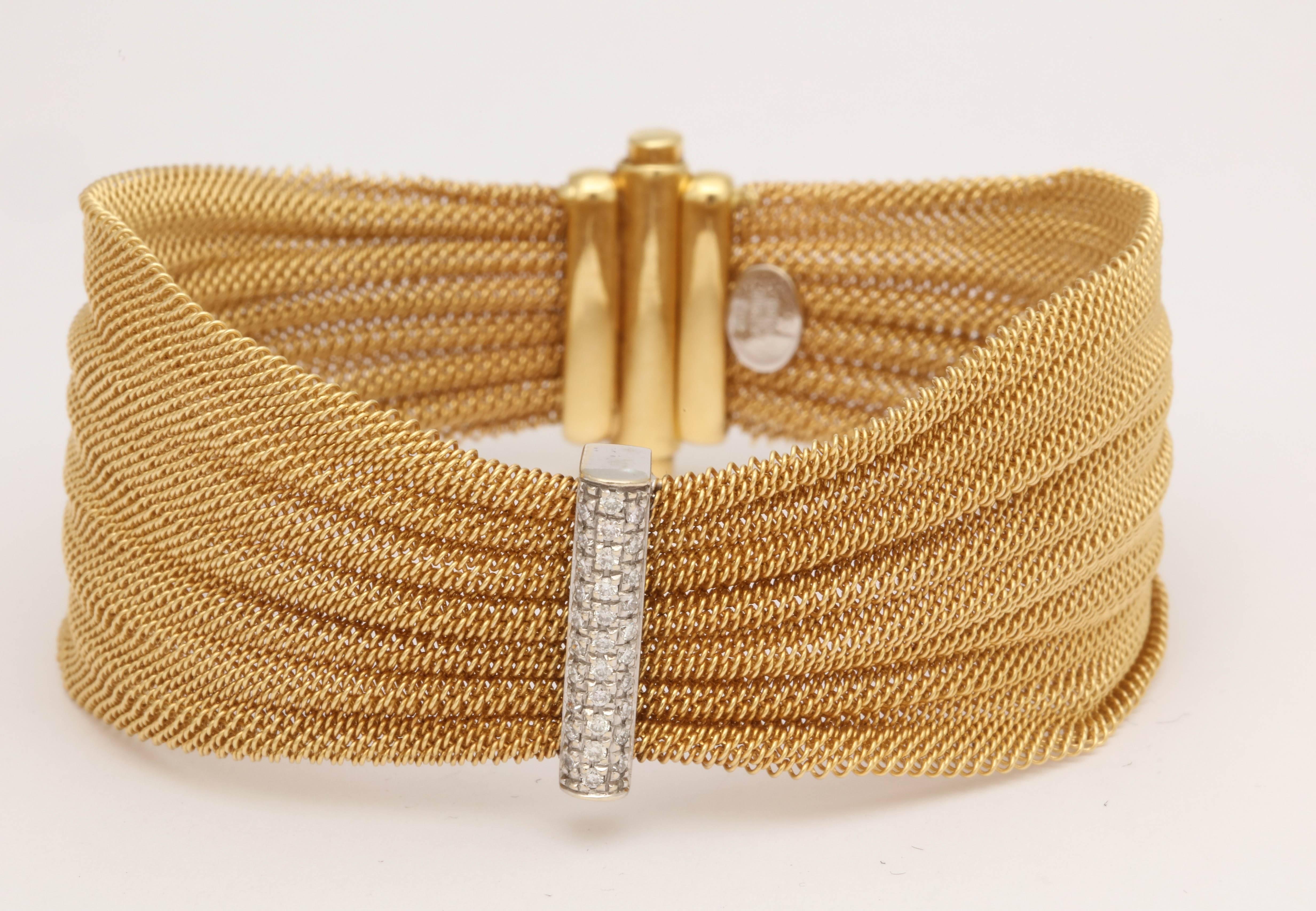 One Ladies Woven Light And Airy Delicate Flexible Mesh Bracelet With A Ribbon And Bow Motif Design Centering Three Rows Of Diamonds. Bracelet Made In 18kt Yellow gold In the 1960's.Beautifully Finished With an Invisible double lock Lipstick Clasp.