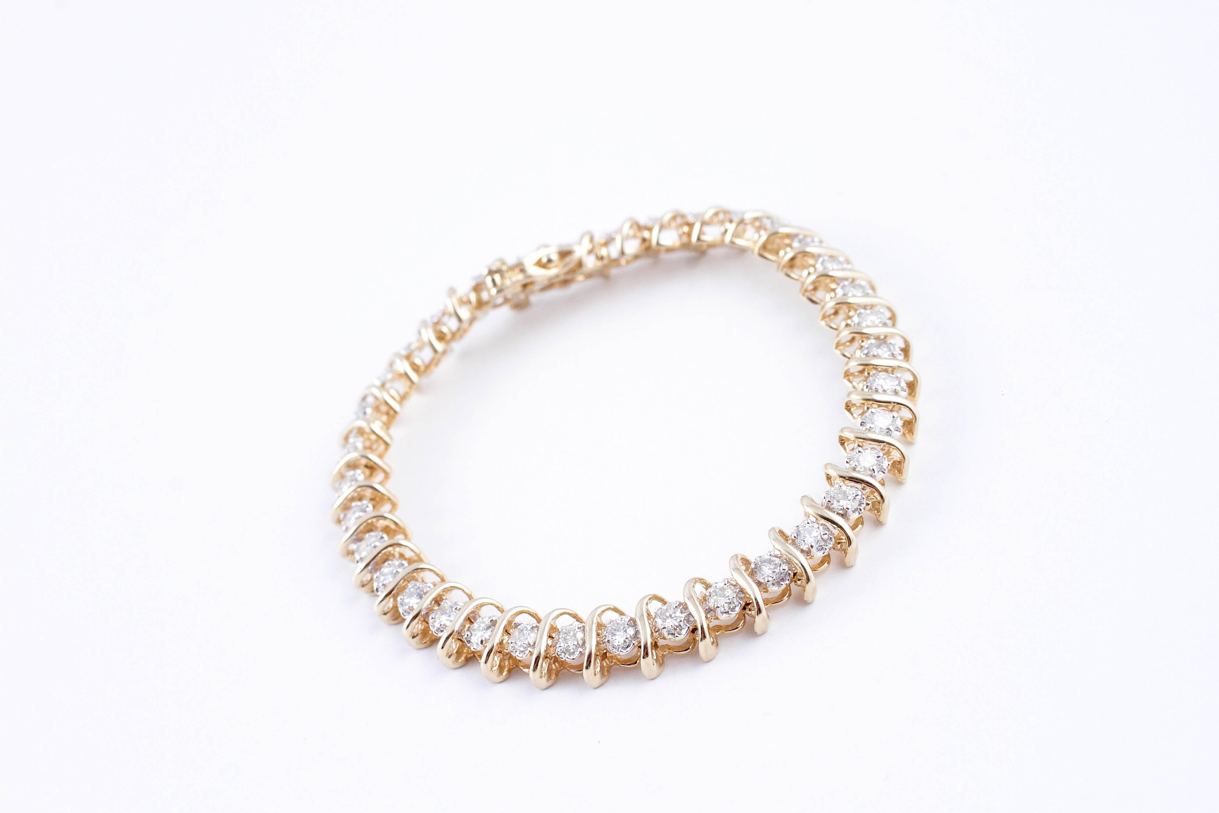 Classic 2.25 carat diamond "S" bracelet set in 14 Karat yellow gold.  7 Inches.
