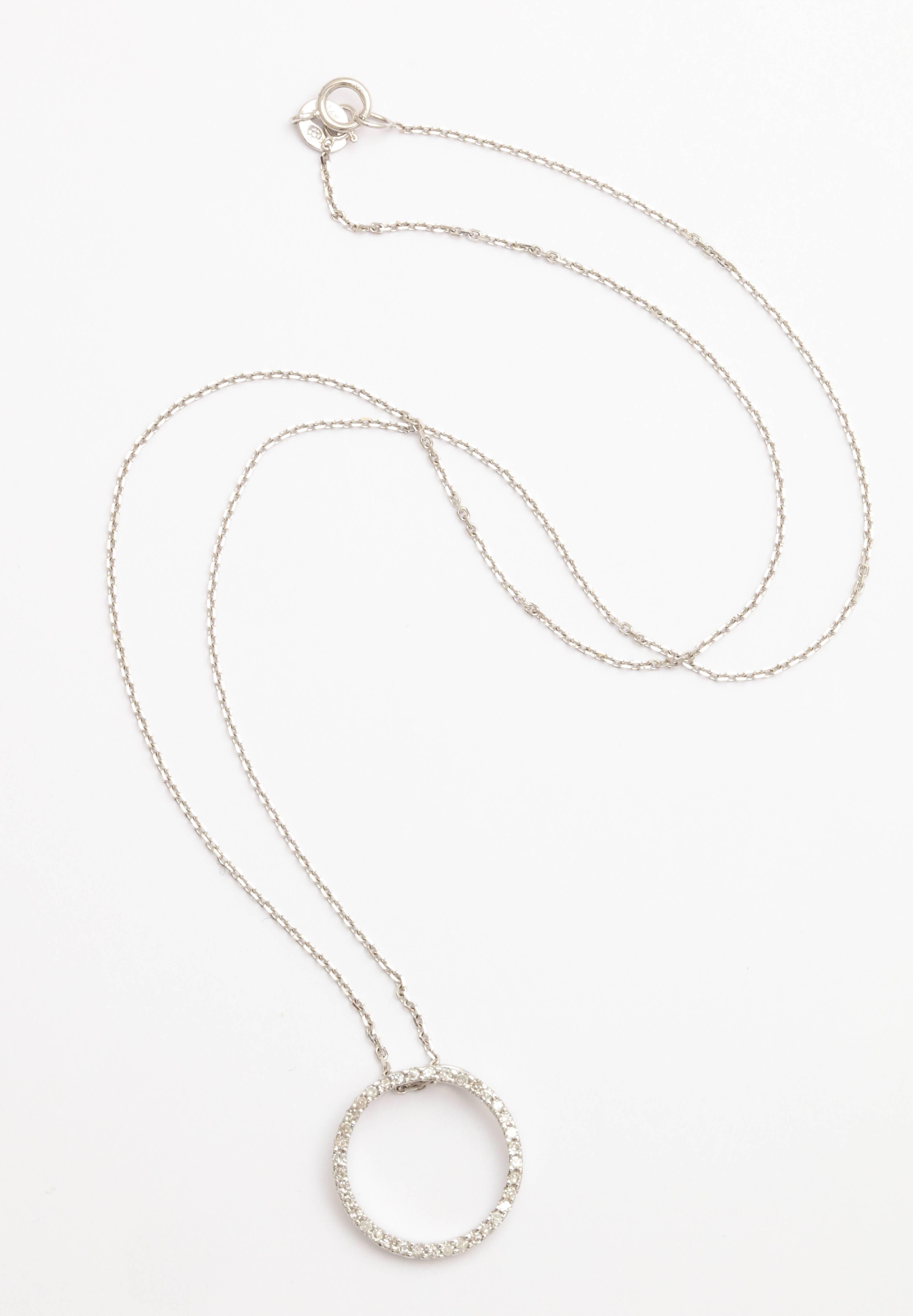 This is a classic Circle of Love or Circle of Life pendant. It is 5/8 in. in diameter and has .48 ct white diamonds. The chain is included. It is 16 in. long and is a diamond cut cable chain in 14 kt white gold. This is a loving gift for any age.