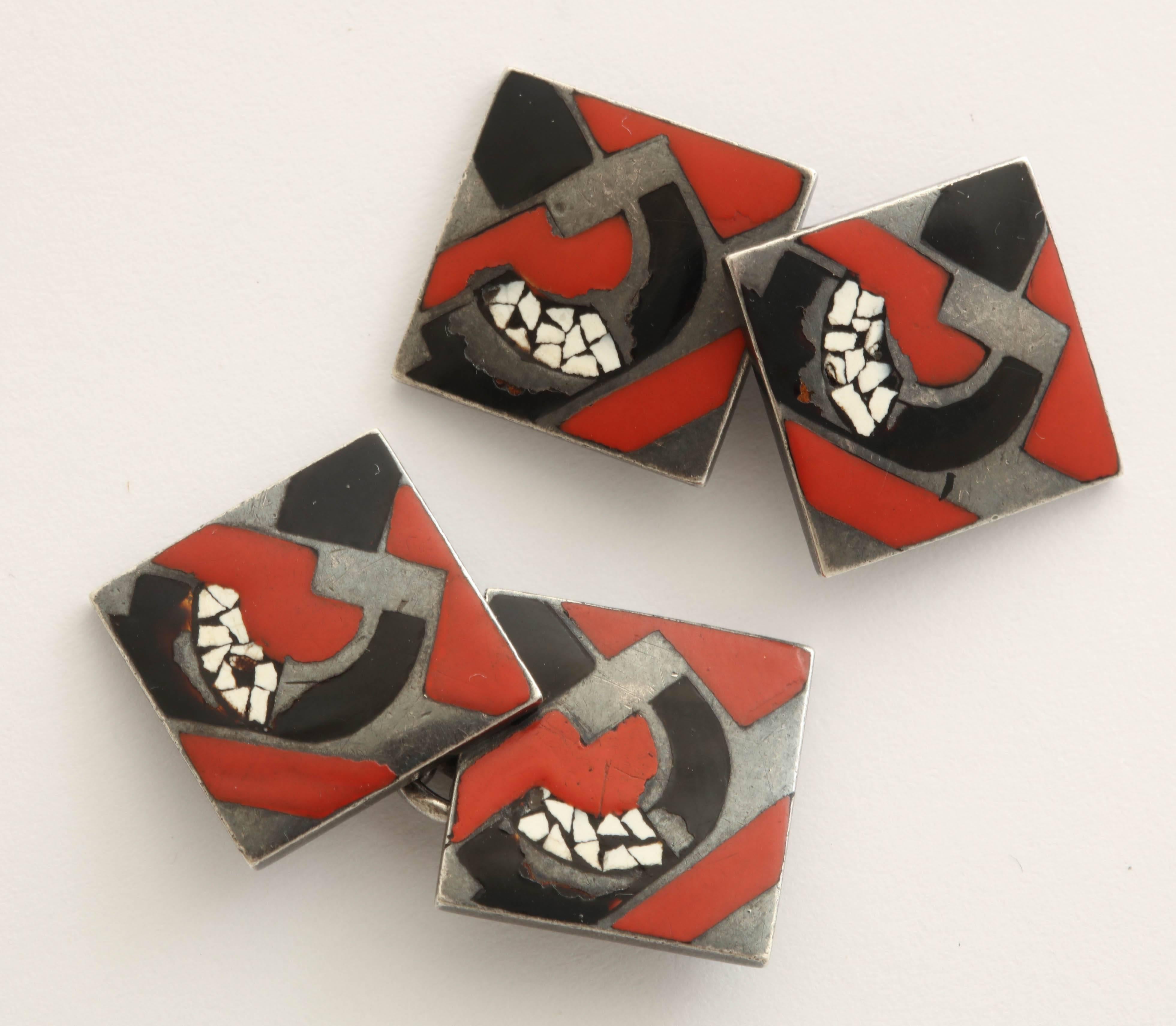 The square cufflinks with red, black and eggshell lacquer applied in geometric motifs.
Signed Gerard Sandoz, with French assay and workshop marks.