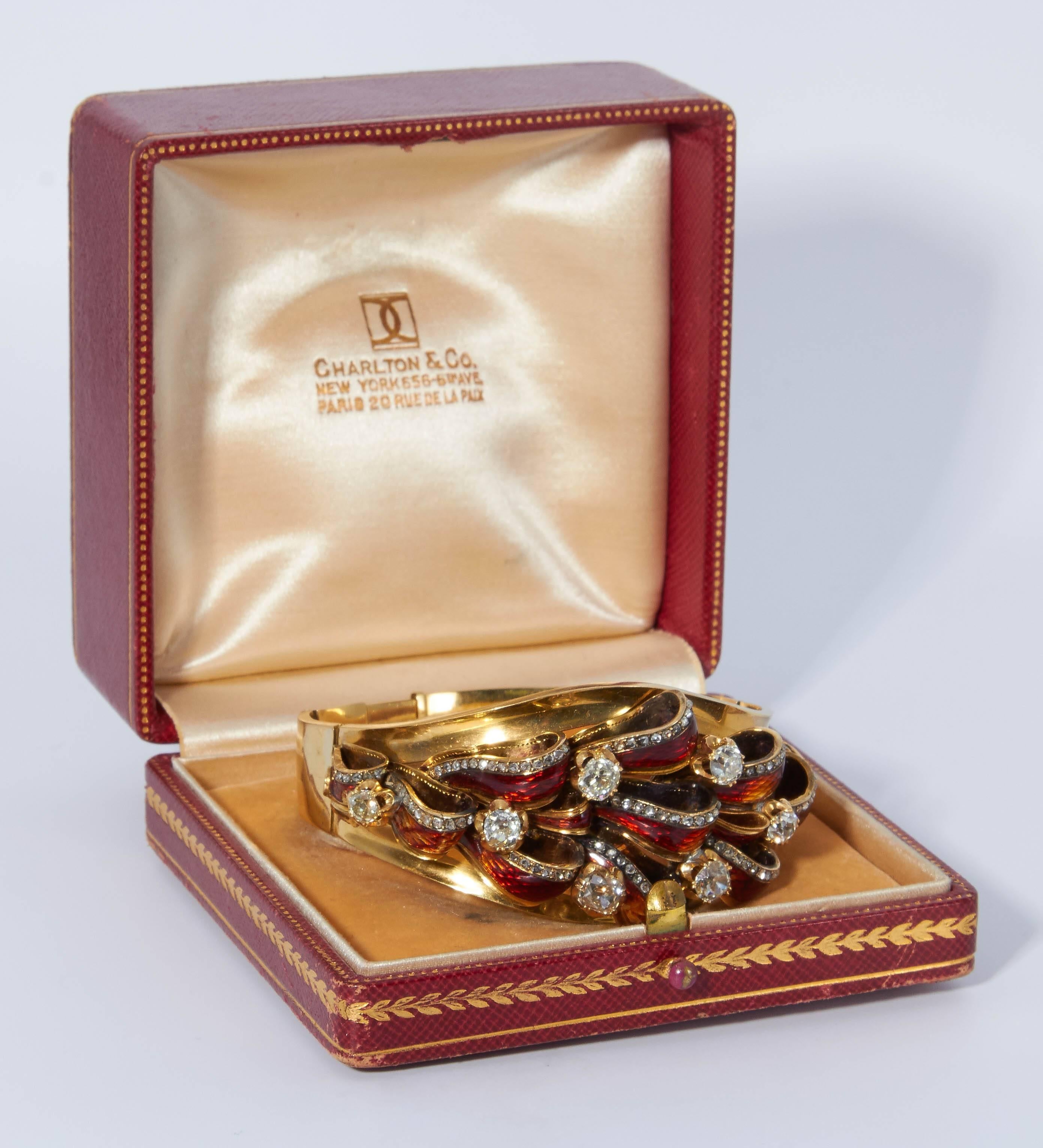 Antique 18kt Gold, Enamel, and Diamond Bracelet, France, the hinged bangle with enamel ribbon motif and set with seven old mine-cut diamonds, rose-cut diamond accents, 25.3 dwt, adjustable length, in a box for Charlton & Co.,
French Hallmark
