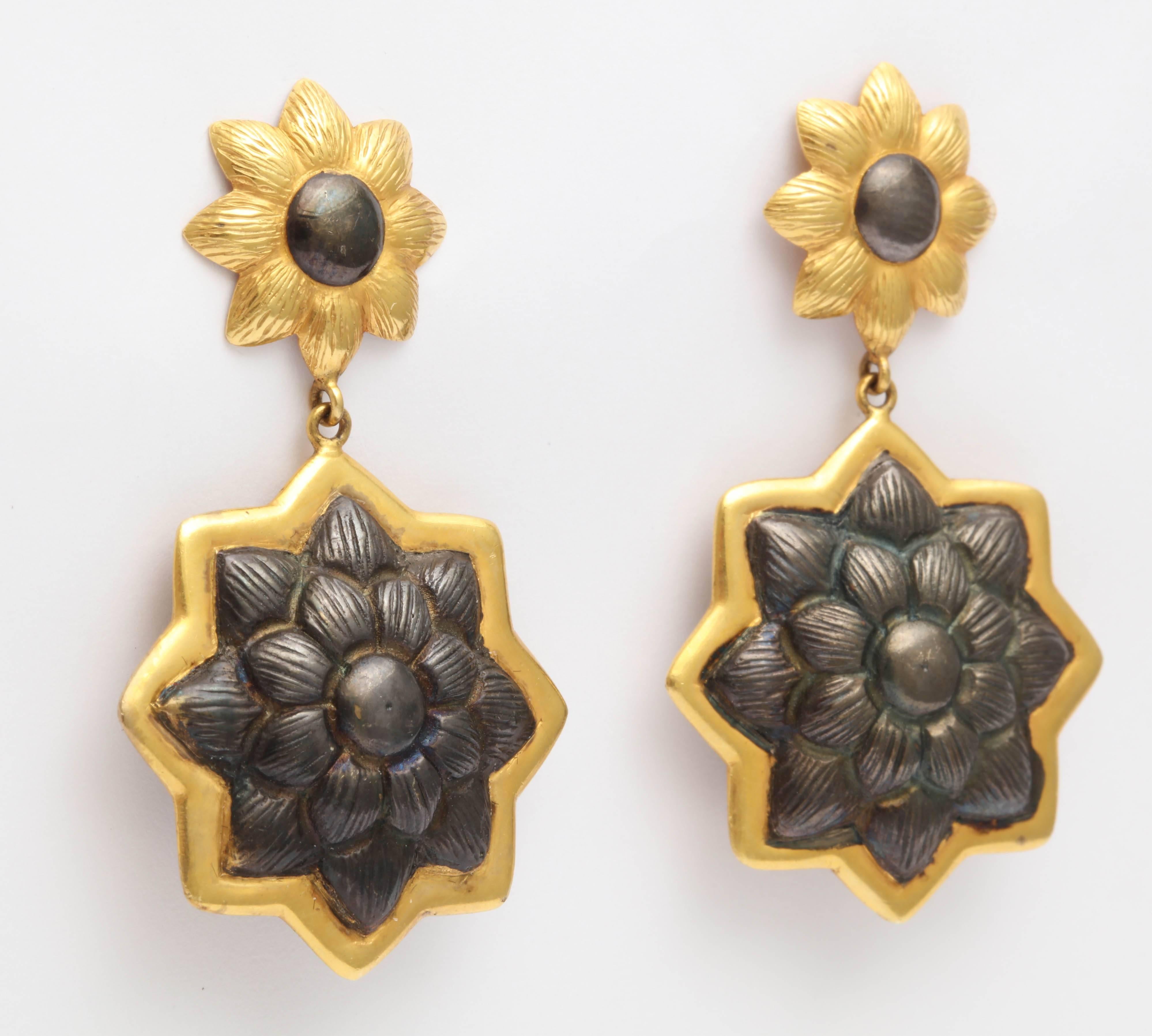 Fabulous Earrings with Indian Floral elements in Silver bordered by 18kt Yellow Gold Borders.  Strong and very basic. Tops reverse metals of bottom Sunflower elements.   Pierced tops.  