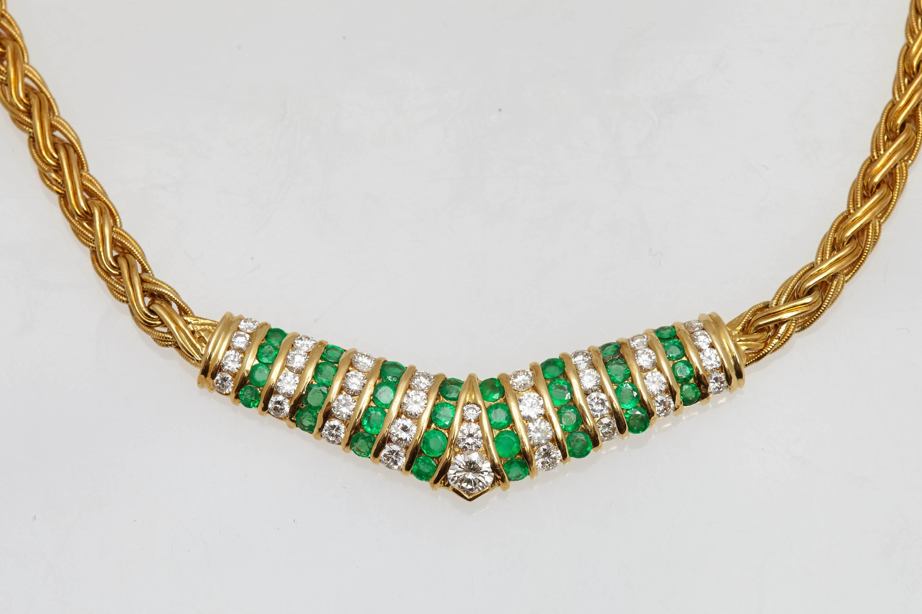 A matching set of eighteen karat yellow gold necklace and earrings made up of round diamonds and round emeralds.  There are approximately four carats in diamonds and 2.50 carats in emeralds. The diamonds and emeralds are of fine quality. The