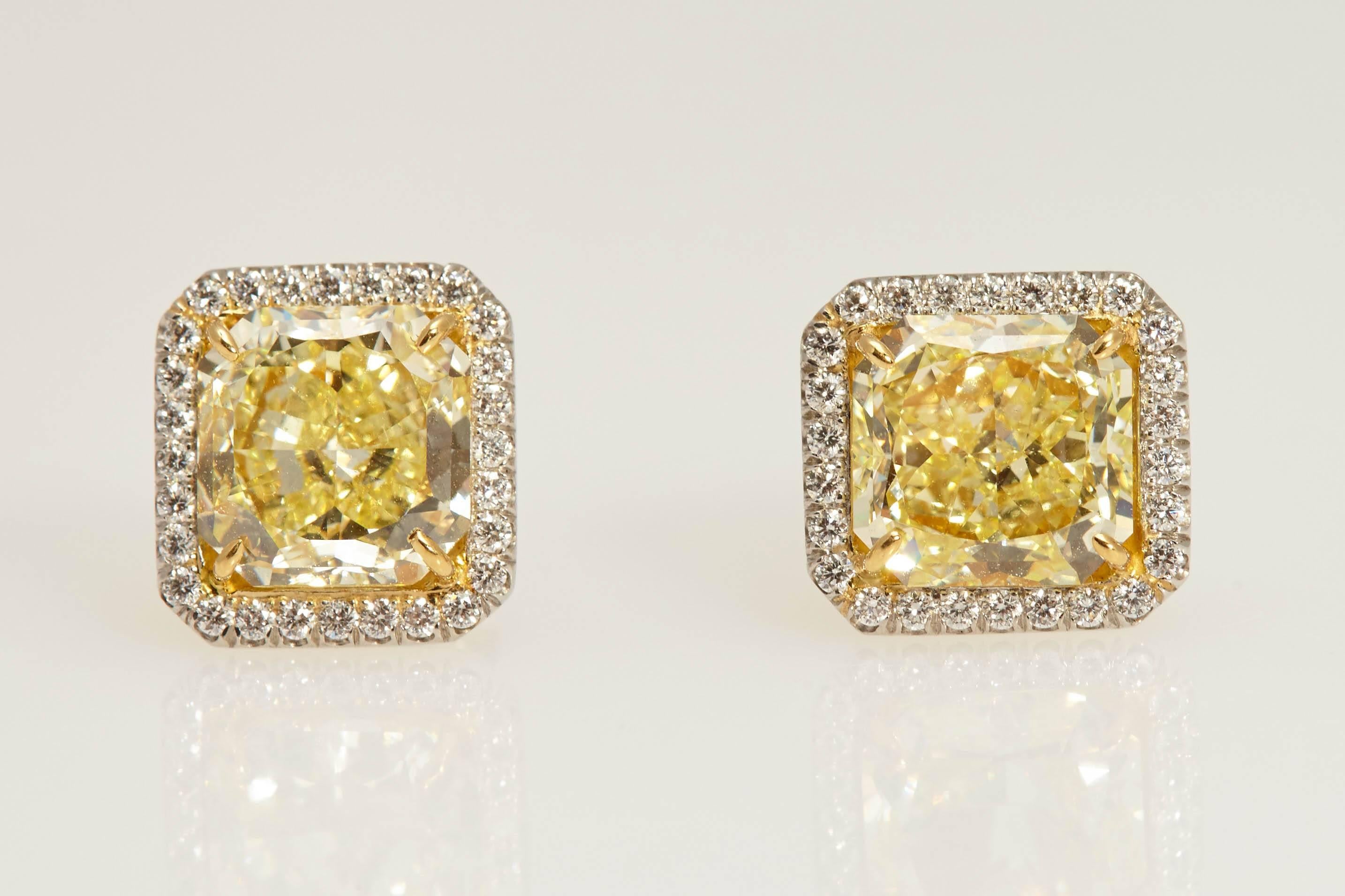 Radiant GIA Fancy Yellow Diamond Earrings 6.61 Carat For Sale 1