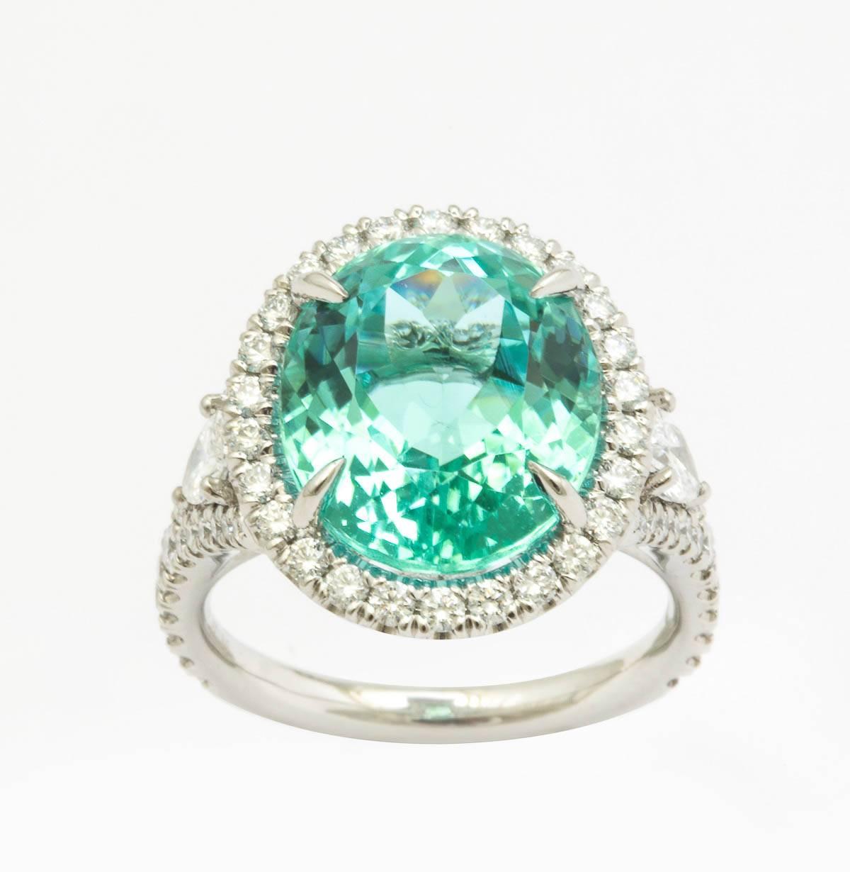 Platinum oval cut Paraiba Tourmaline and diamond cocktail ring containing center Paraiba 8.67ct., flanked by two pear shaped diamonds set in pave diamond set mounting  1.04 ct. total wieght 

GIA report