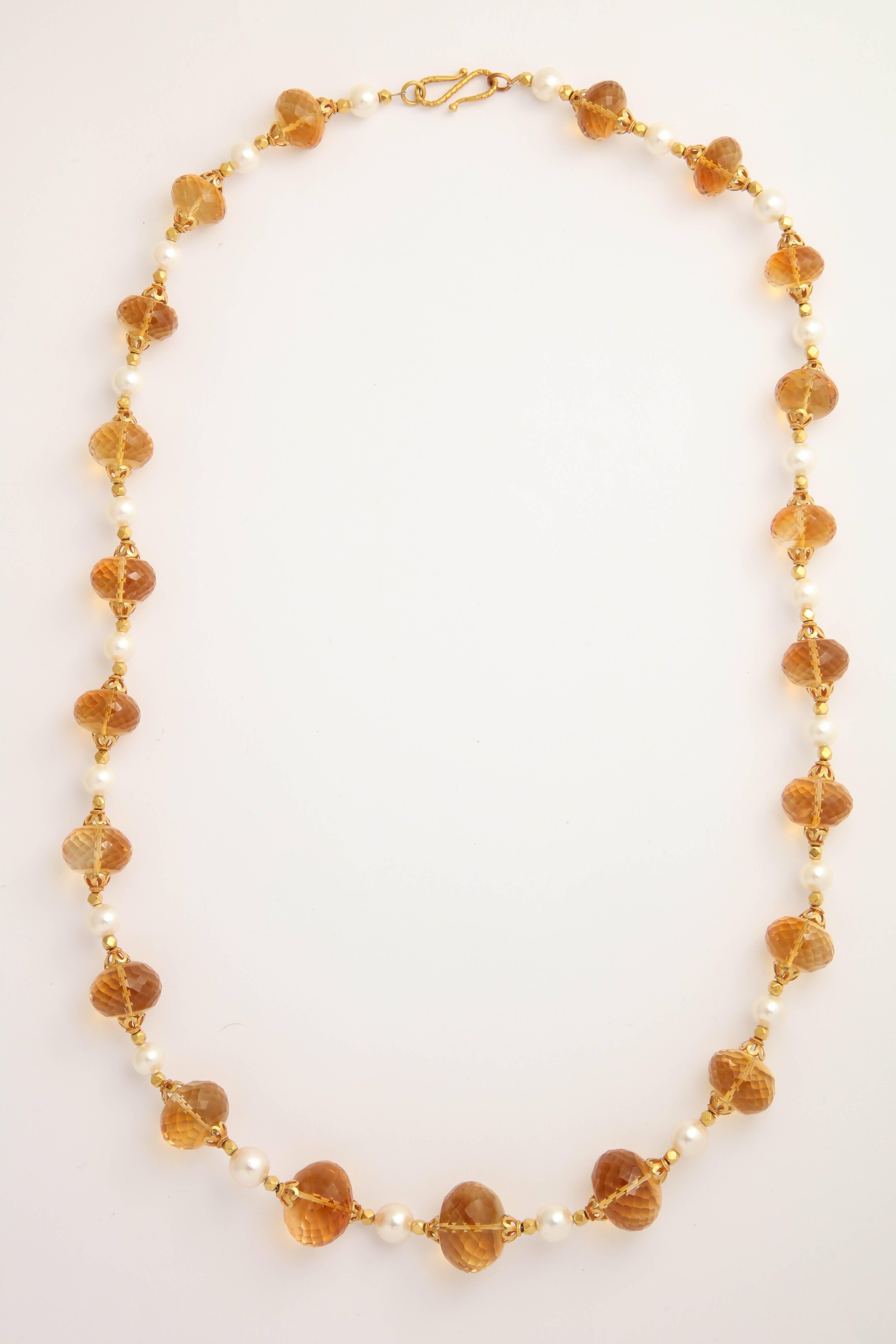 These spectacular faceted citrine beads are not heat treated or irradiated. They are micro faceted to give them extreme sparkle. The fresh water pearls in between them are 6-8 mm and A-quality. The gold beads are 18kt, a filigree cap on either side