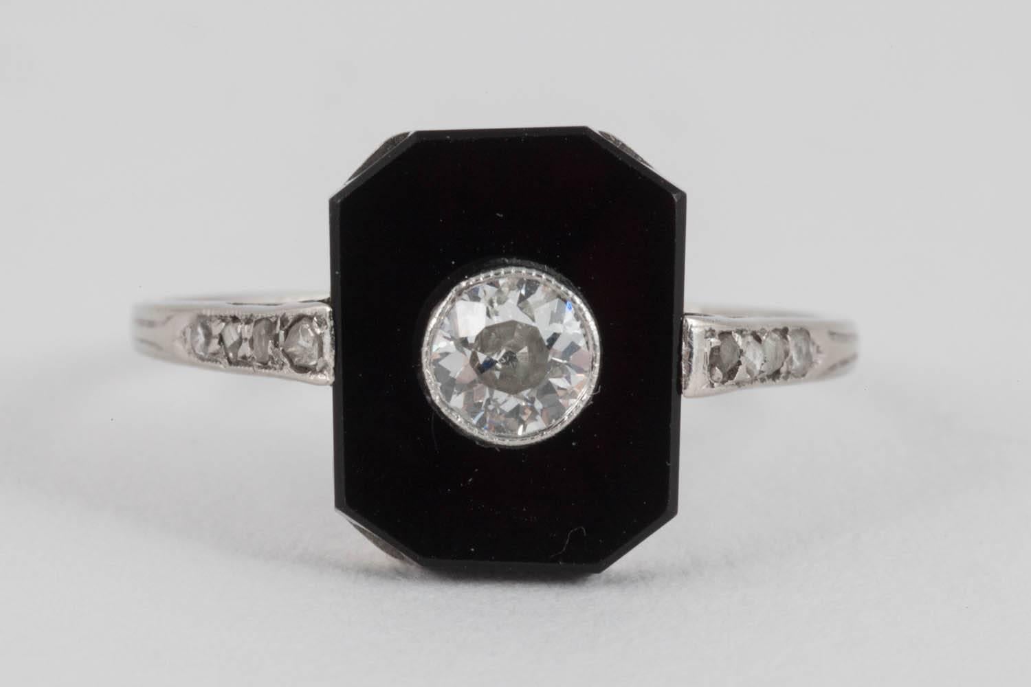 Platinum set Art Deco Onyx and Diamond ring. Centre Diamond  .36ct (est )
Finger size O 1/2
