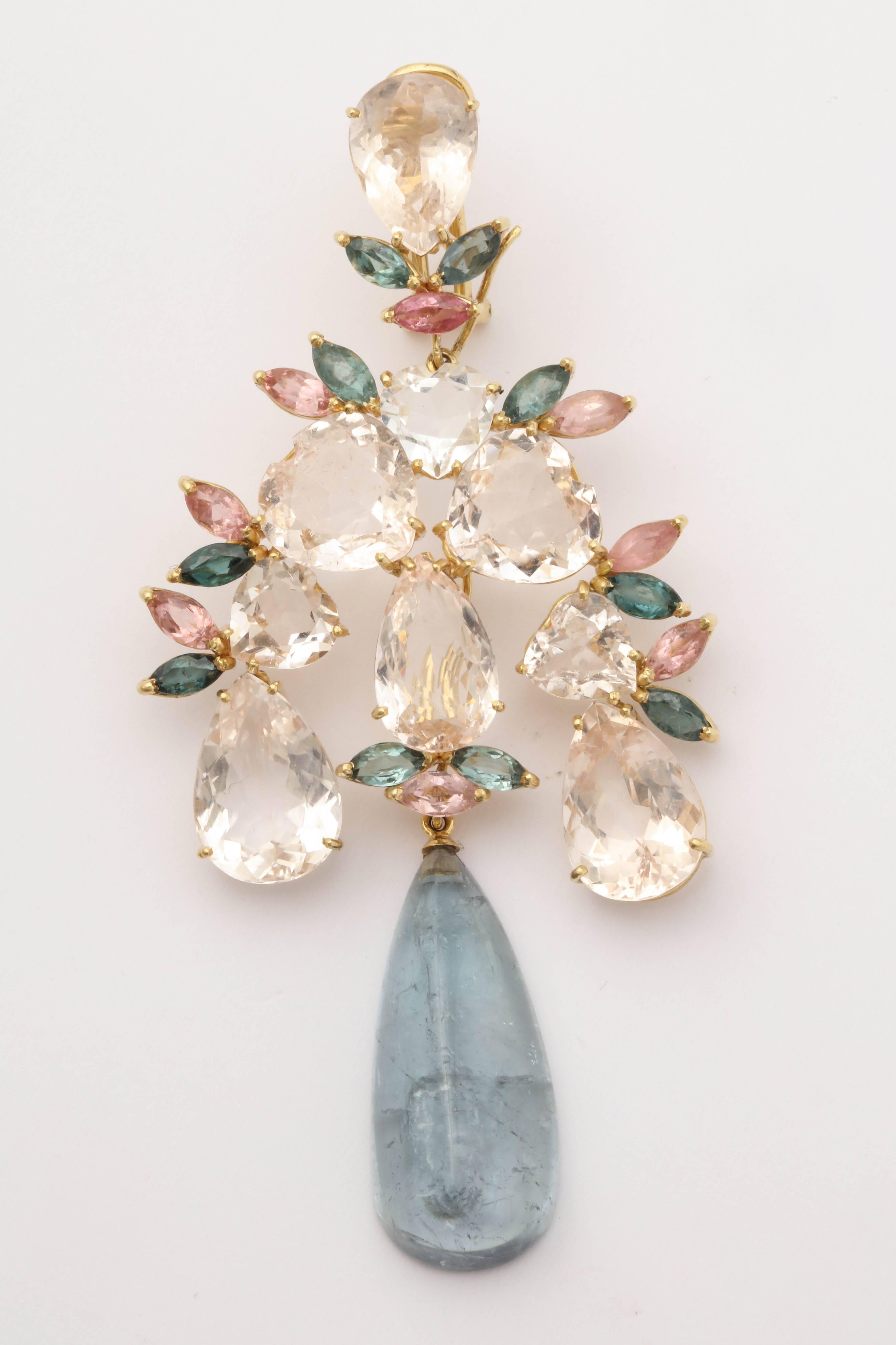One Pair Of Ladies Detachable And Convertible Dramatic Earrings Embellished With Numerous Pear Shaped and Marquis Cut Pale Pink Kunzites And With Twenty Marquis Cut Green Tourmalines. One Large Cabochon Cut Tear Drop Aquamarine Stone Measuring