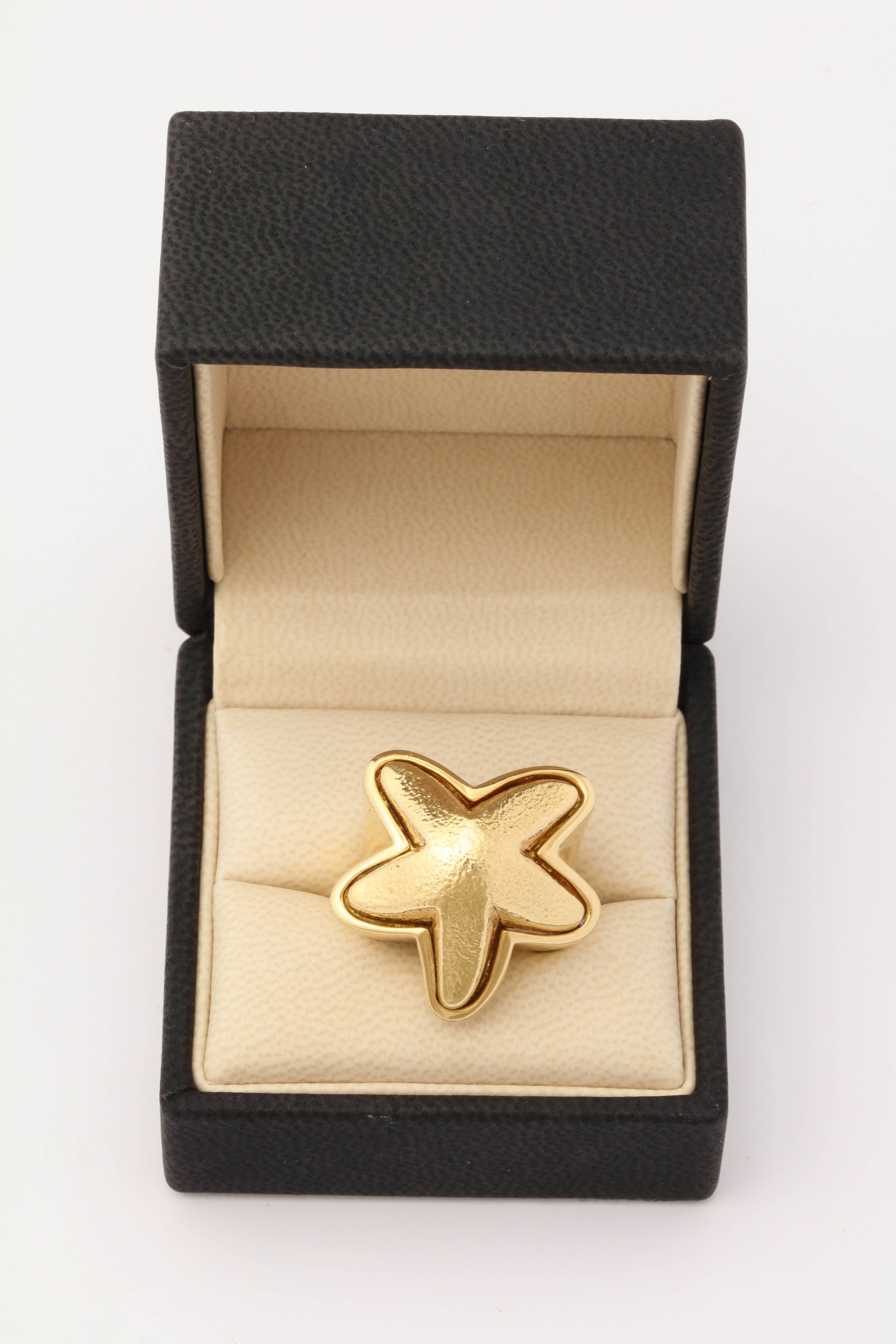 One Artisan Crafted Large Figural 18kt Yellow Gold Asymmetrical Starfish Ring With Mixed Textured Gold Design. The Starfish Itself Is Created With Hand Hammered Textured Gold Craftmanship And The Rest Of The Piece Is Made In 18kt High Polish Gold