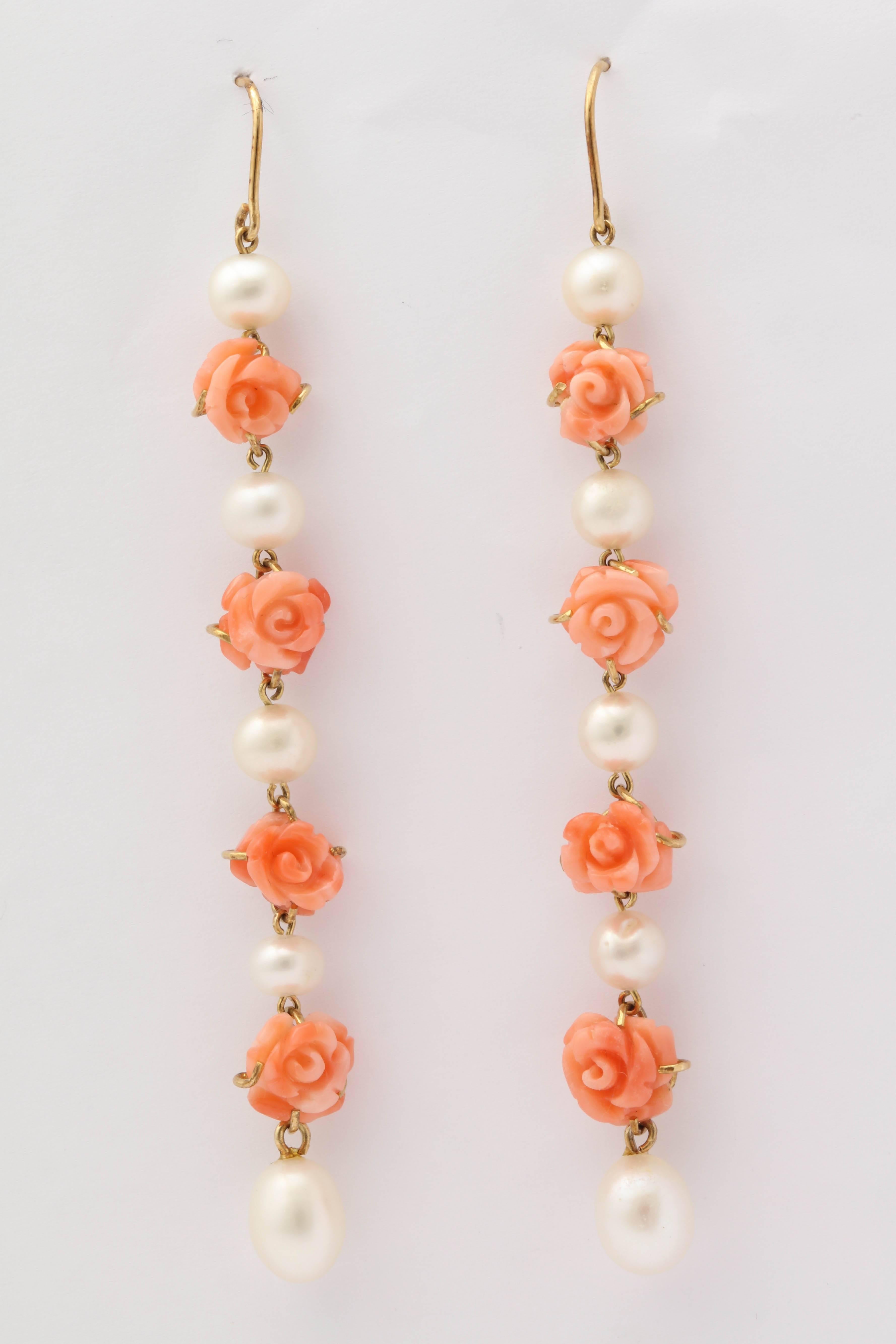 One Pair Of Ladies 18kt Gold Dangle Earrings Designed With Alternating Eight Carved Floral Coral Stones And Further Designed With 10 Cultured Pearls Measuring Approximately On Average 5Mm Each.Made In America In The 1950's.