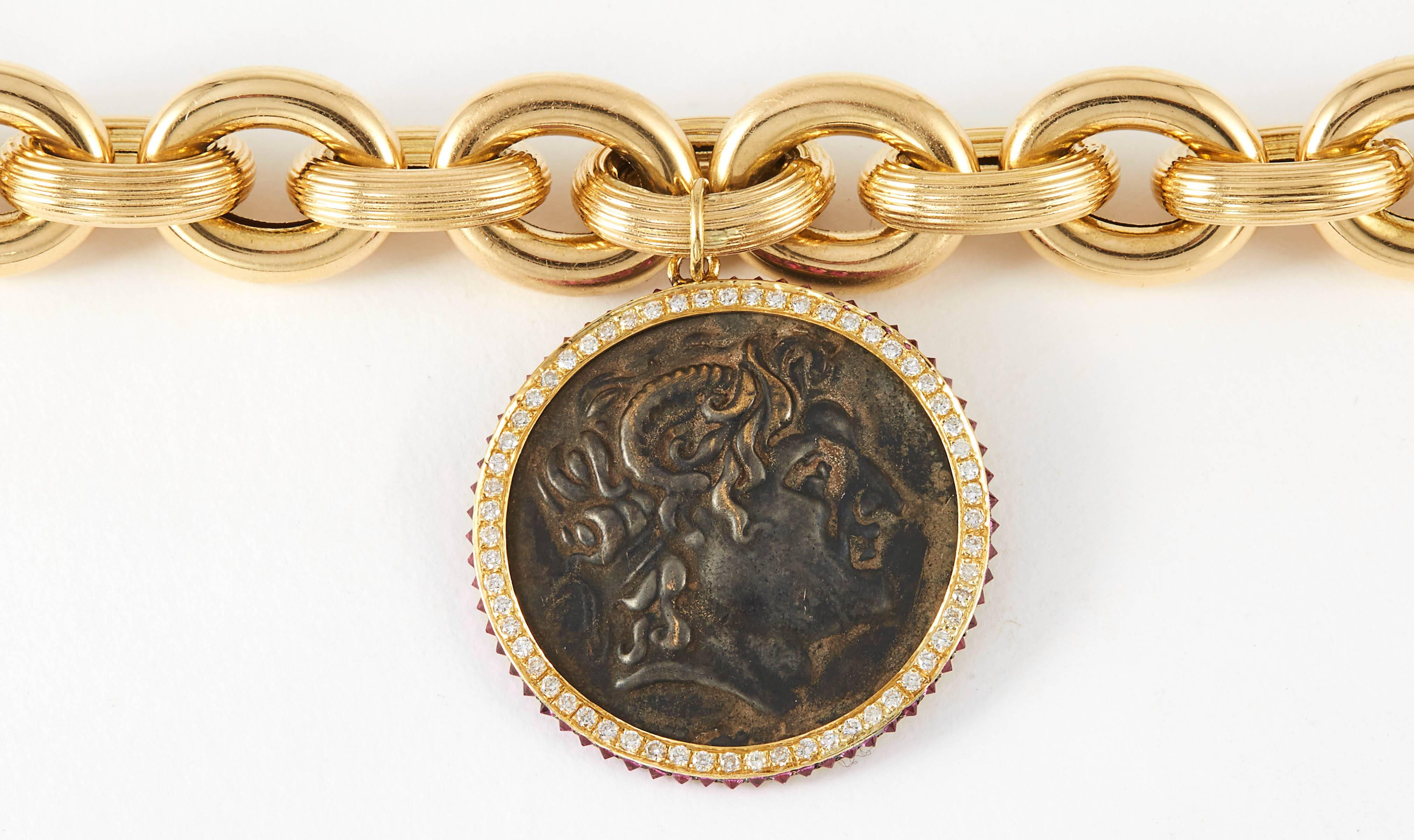 SAM.SAAB Ancient 15th century roman bronze coin with 1.05ct white diamonds and 1.17ct red spinel accents on a 18k yellow gold chain.