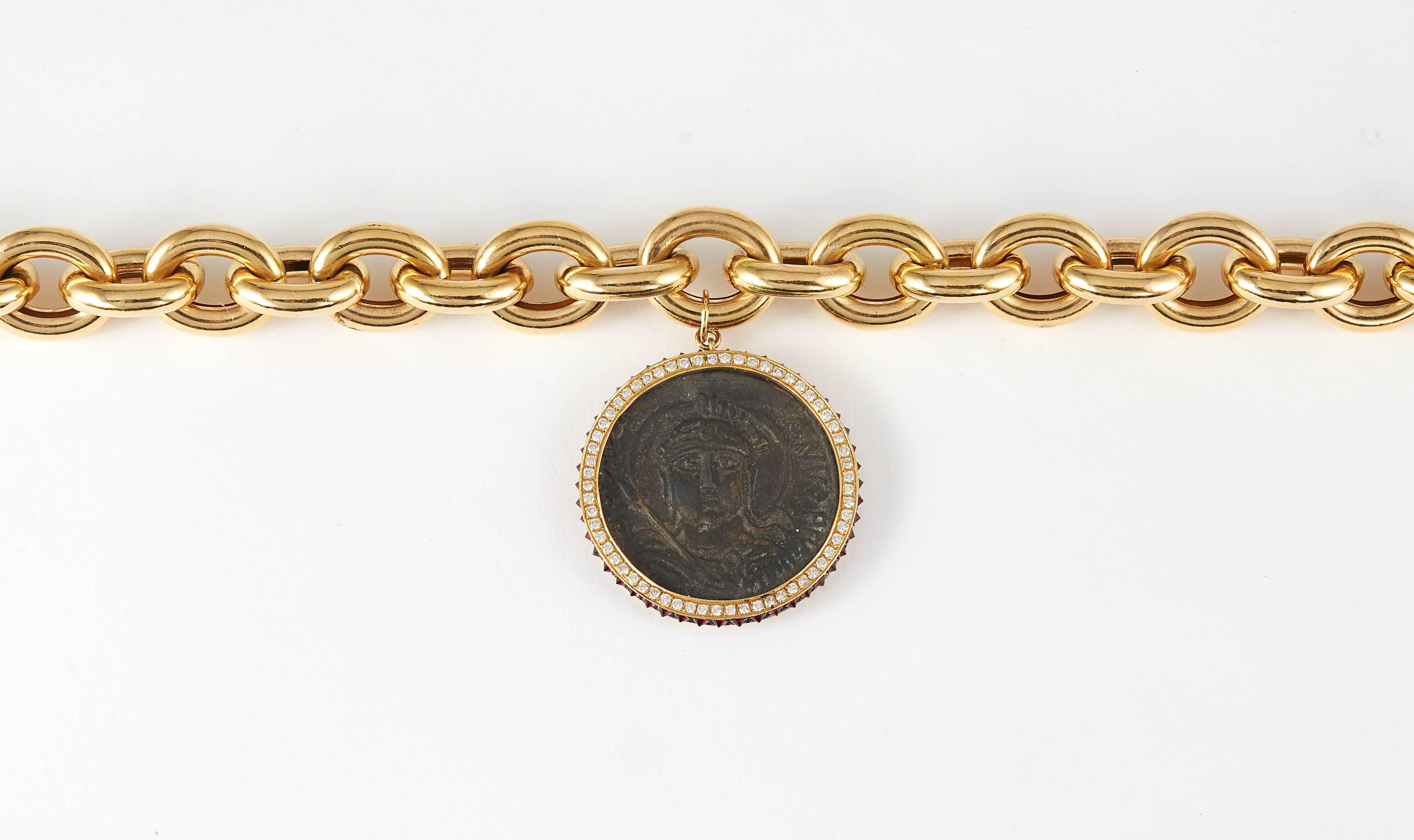 SAM.SAAB Ancient 15th Century Roman Coin in bronze with 1.83ct white diamonds and 1.17ct red spinel accents on an 19inch 18k yellow gold chain.