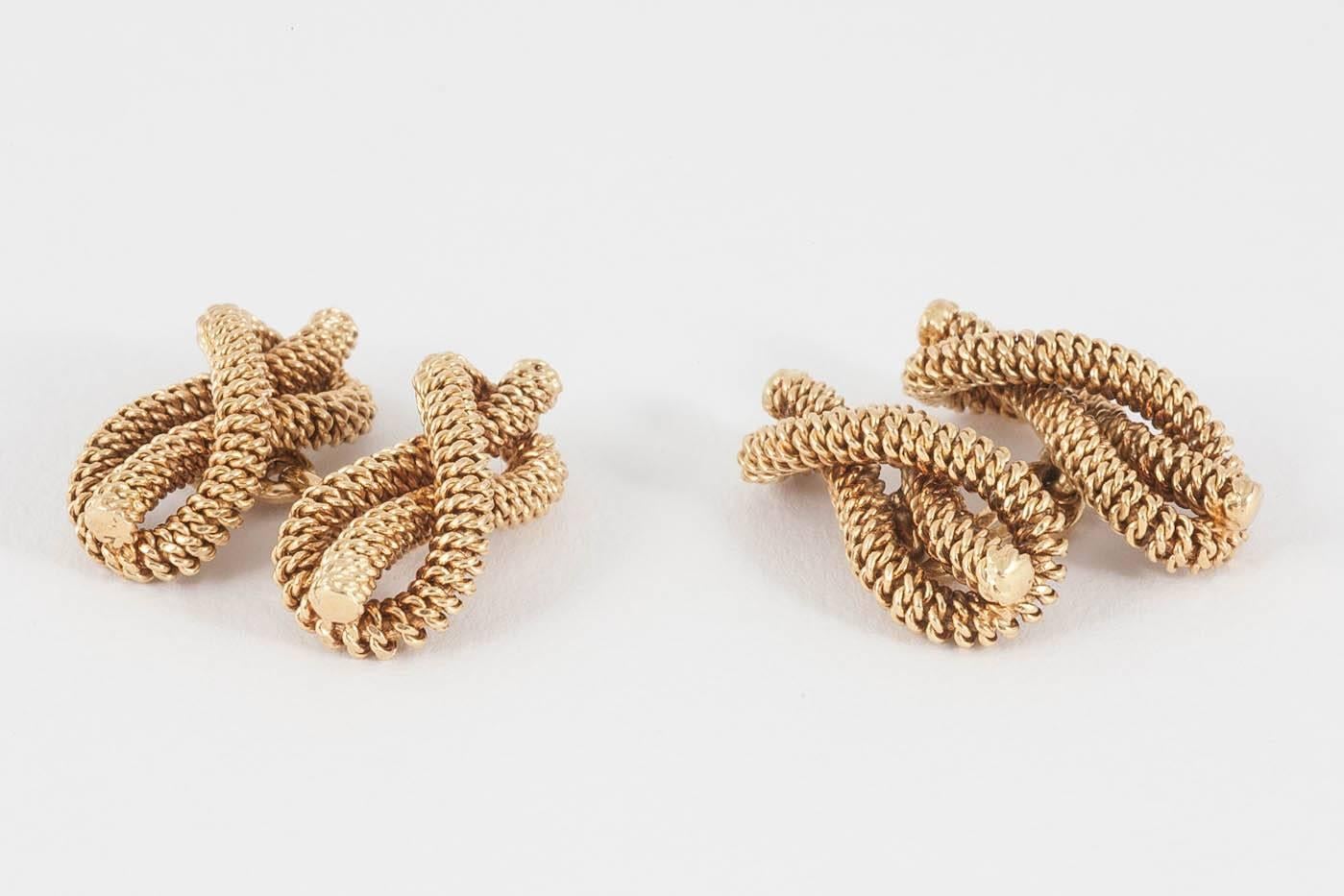 A heavy quality pair of 18kt yellow gold double sided cufflinks in the form of a reef knot or figure of eight, in a wirework design, finely made .signed Tiffany and co. Italy circa 1950-60