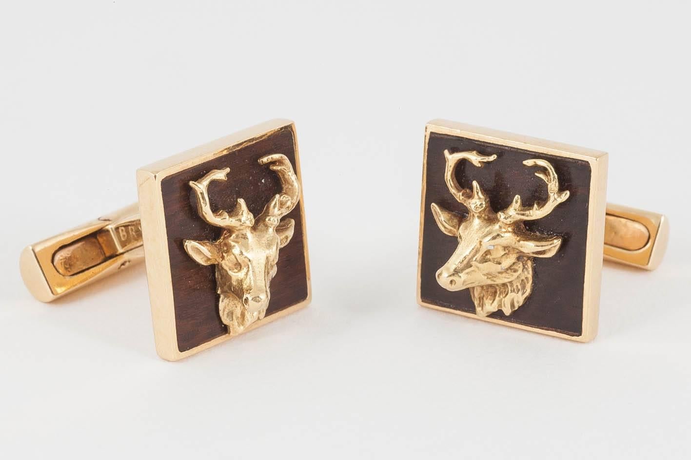 A heavy quality and unusual pair of single sided cufflinks in 18ct yellow gold with a bog oak [wood]background and mounted,a stags head with antlers.Signed BRY of Paris with French marks and numbered 8585.c.1930-50