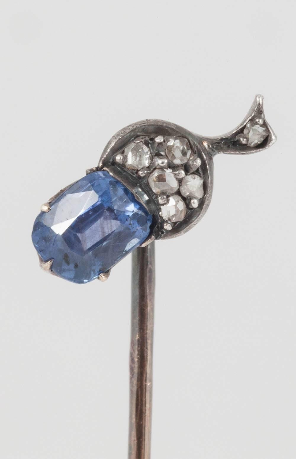 A fine quality Tiepin in the form of an Acorn in silver and 18ct yellow gold,set with rose cut diamonds,and an attractive,pale Ceylon sapphire, of cornflower  colour.French marks to the pin .French c,1880 