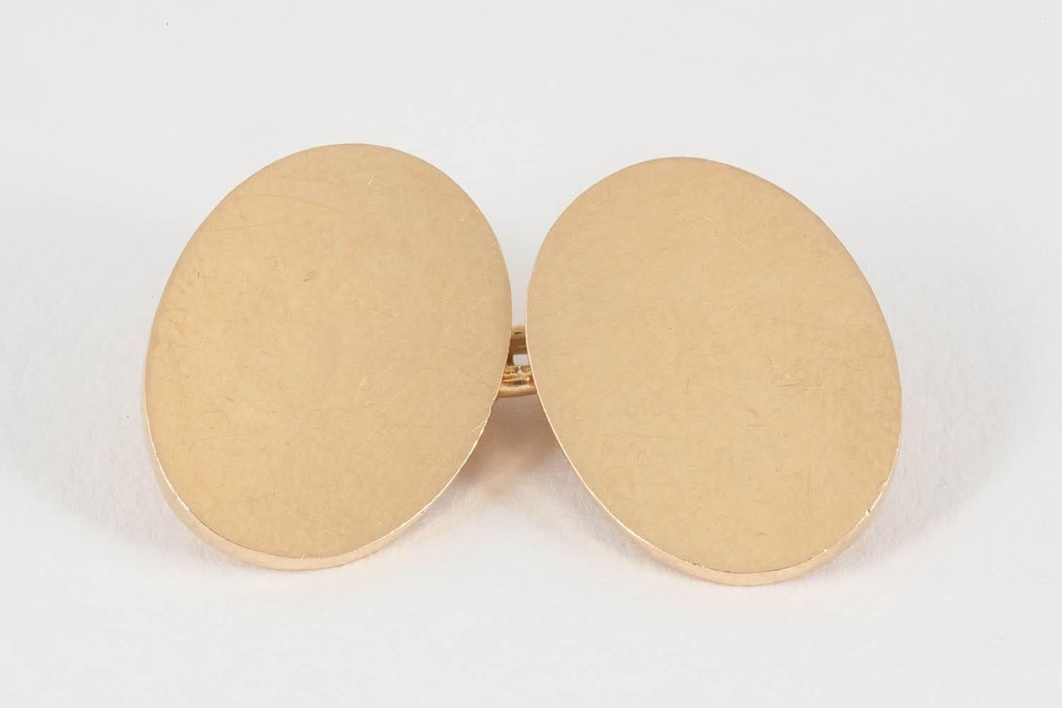 A heavy quality pair of oval,double sided 18ct yellow gold cufflinks with chain link connections,English hallmarked for Birmingham 1927.weight 23 grammes