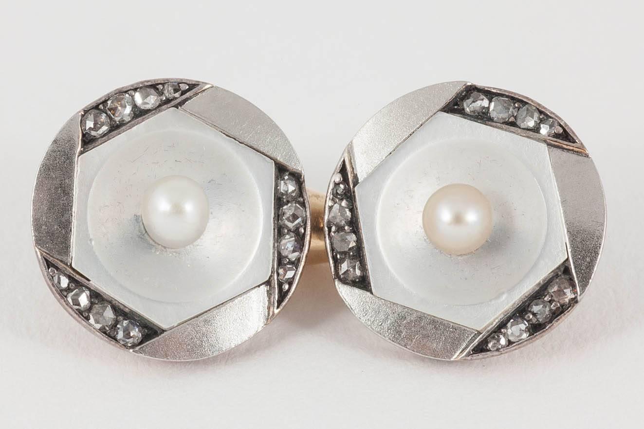 Pair of unusual,14kt yellow gold double sided cufflinks,set with a central,natural pearl on a mother of pearl background,and edged in rose cut diamonds at intervals.Austrian marks engraved,c,1890-1900