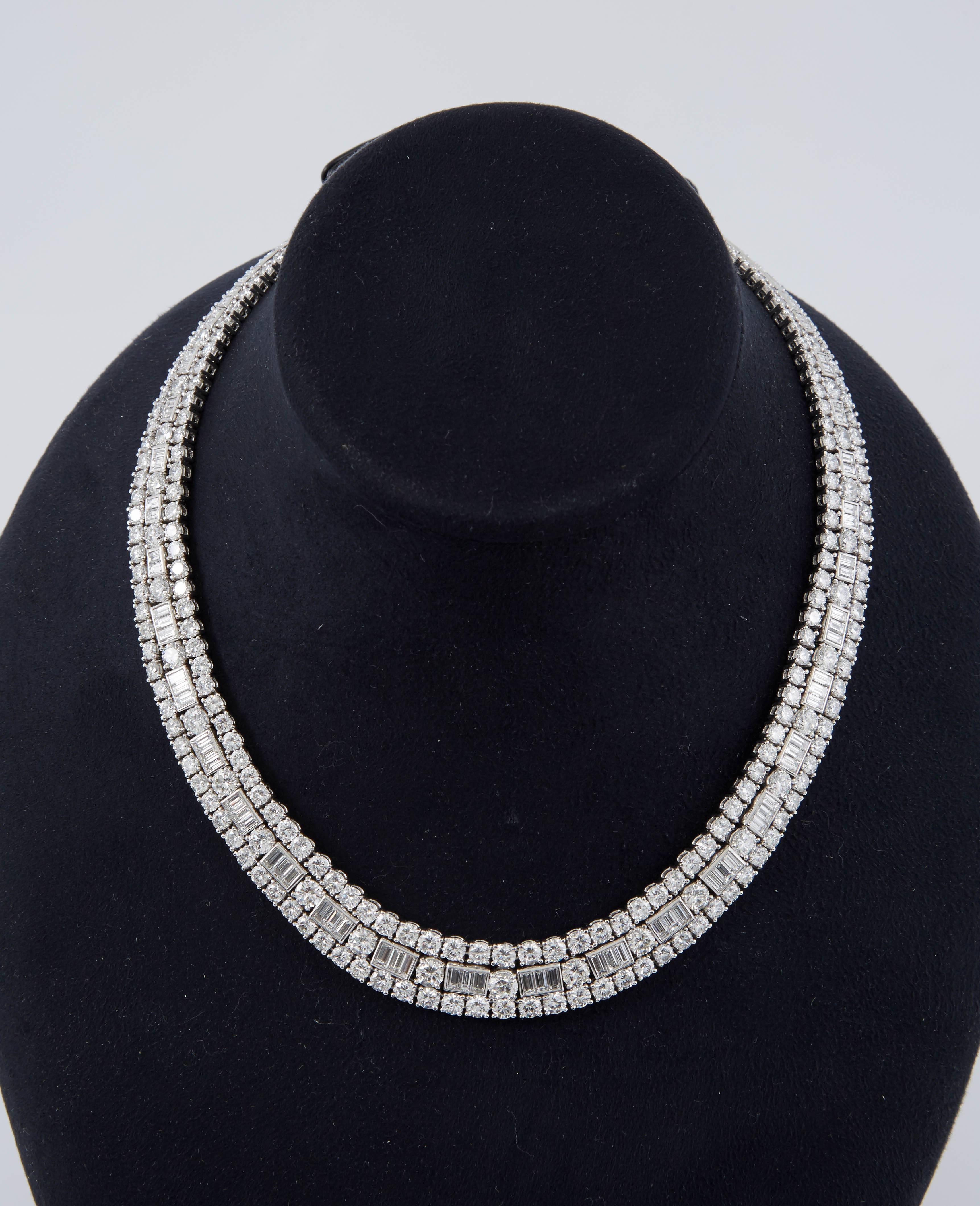 Finely crafted in platinum with round brilliant and baguette cut diamonds weighing approximately a total of 48.00 carats.
Signed and certified by David Webb.
