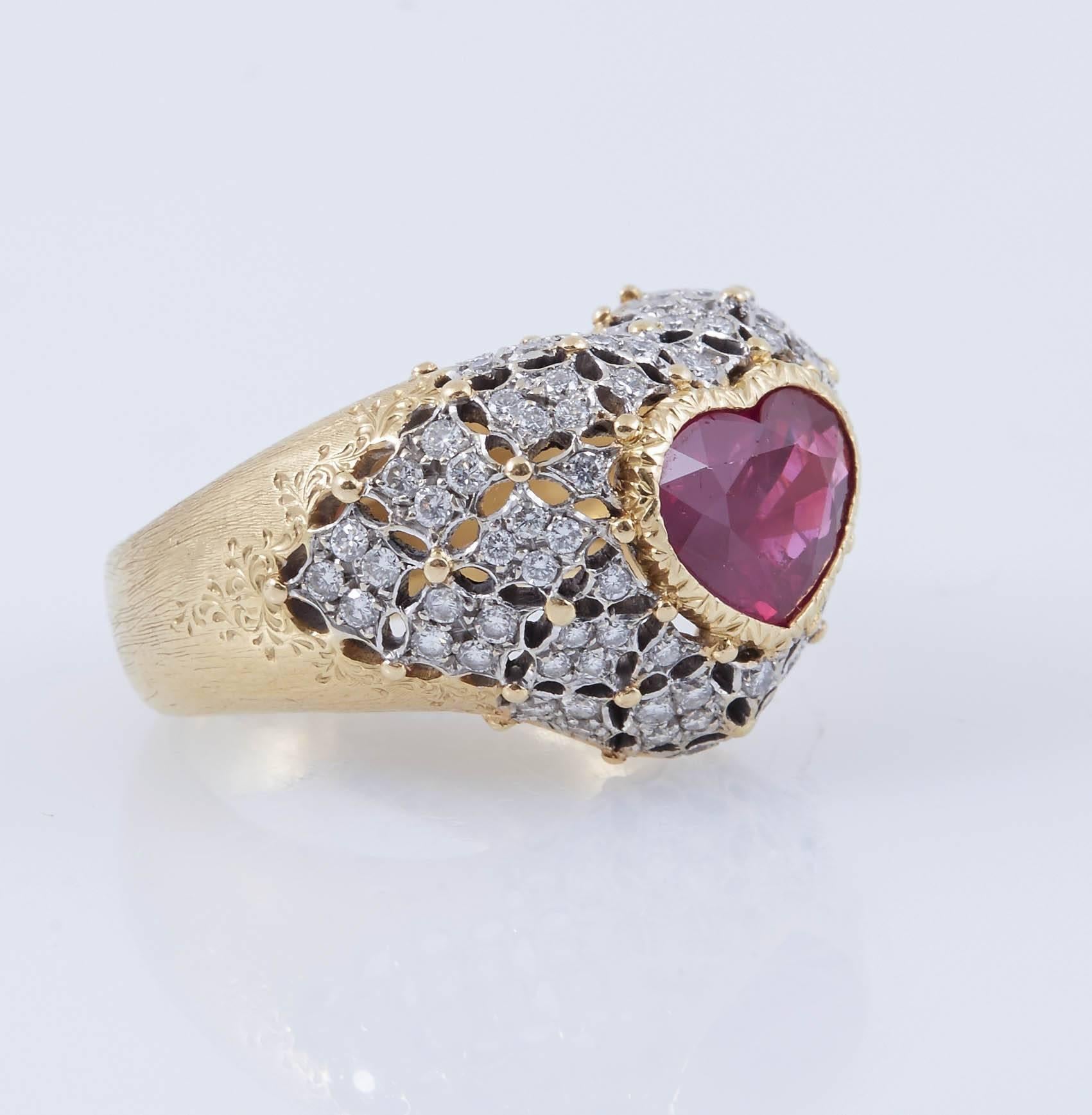 Beautiful heart shaped dinner ring, with natural ruby at the center, weighing approximately 2.50 carat accented with round brilliant-cut diamonds, weighing approximately 2.00 carat mounted in 18k yellow gold and platinum. Signed Buccellati.