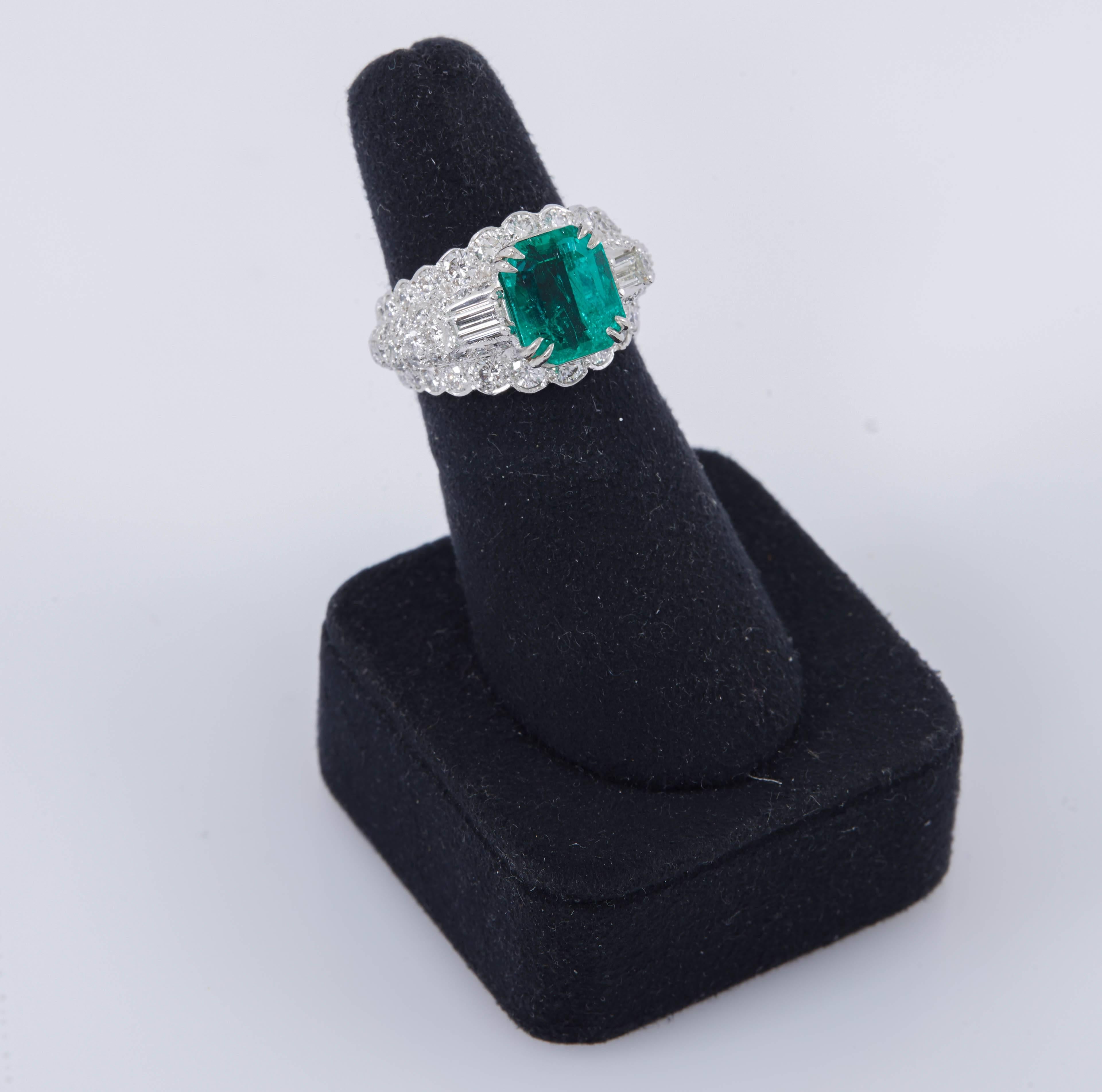 Unique piece from David's Webb high-end collection is centering Natural Emerald cut Green Emerald, weighing approximately 6.00 carat. The center stone is set in beautiful mounting crafted in platinum with high quality, round brilliant and baguette