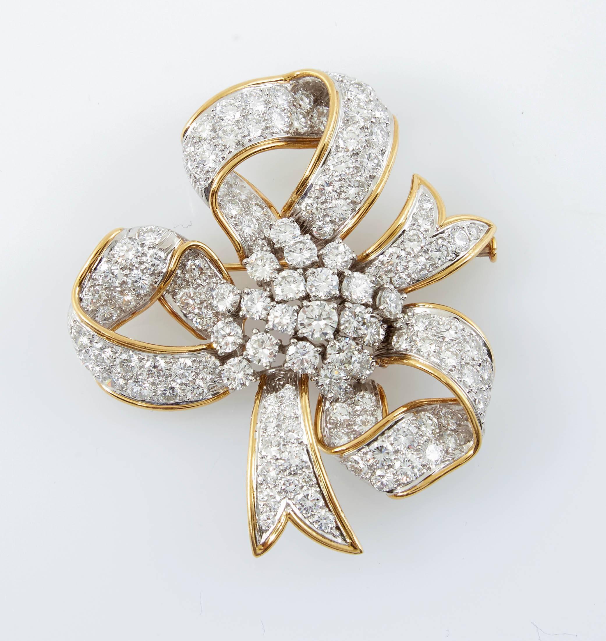 Beautiful bow brooch is finely crafted in 18k yellow gold and platinum with diamonds, weighing a total of approximately 12.00 Carat.
Signed David Webb
