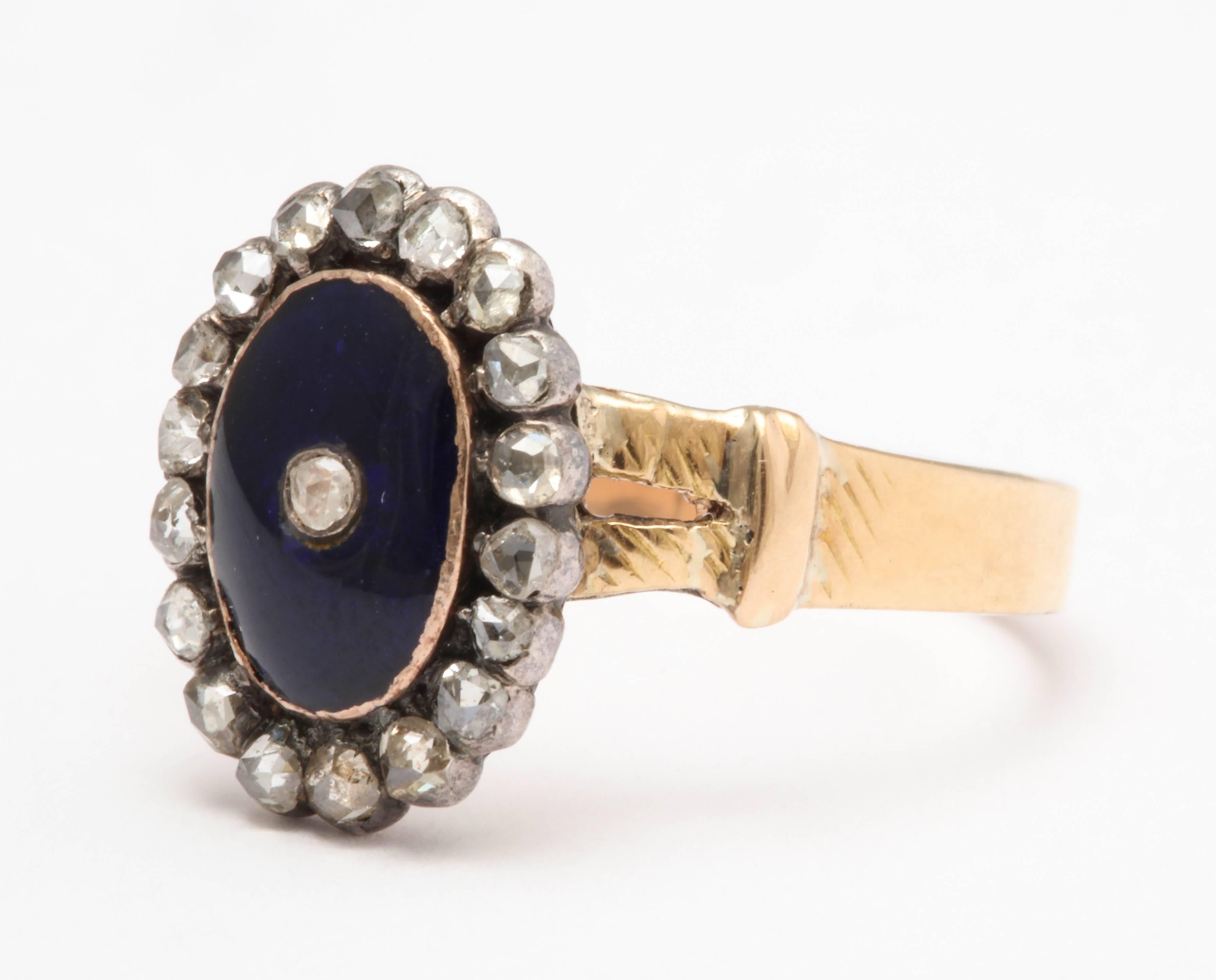 Set in silver over yellow gold with a central blue enamel plaque set with a rose cut diamond and surrounded rose cut diamonds. Dating to 1790 with a slightly later shank- likely from about 1820. 