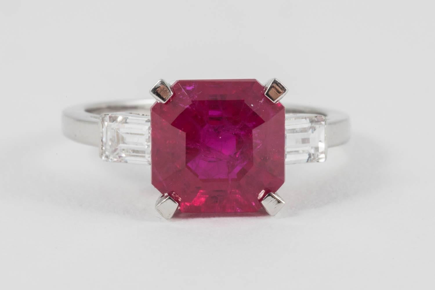 Using the vintage Art Deco mount we have revived this by setting an ethical Don't Waste Beauty Ruby to it. The ruby is of fine pigeon blood colour, with excellent saturation and weighs approximately 3.25 carats. The 2 shoulder baguette cut diamonds
