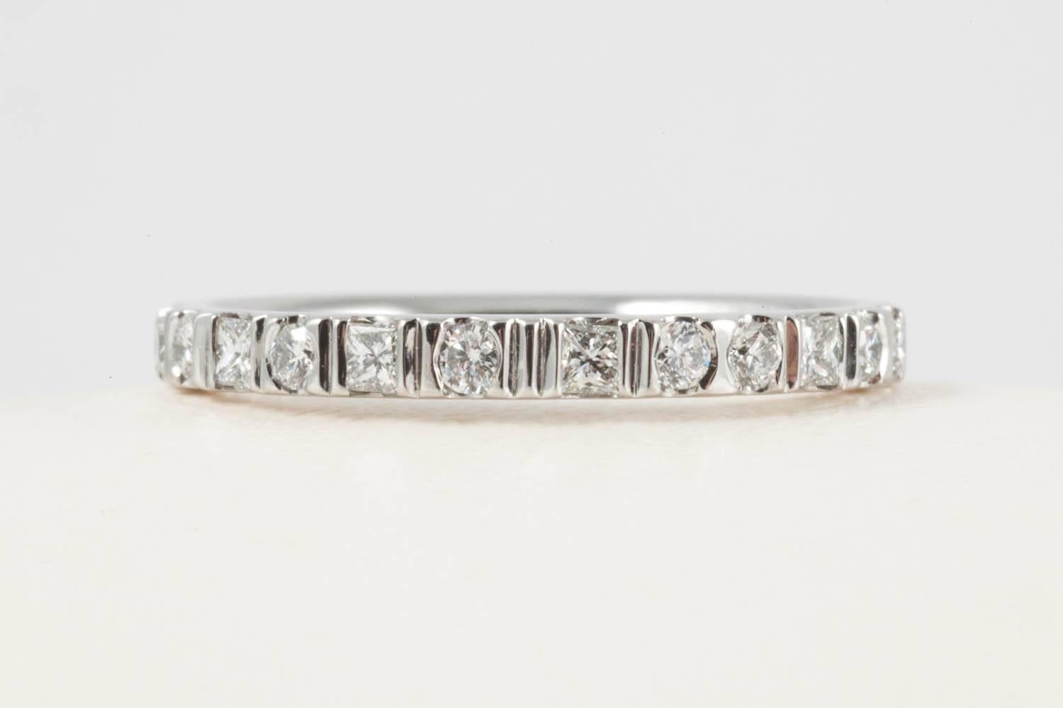 Code by Edge uses the zeros and ones of the binary code in round and premium cut princess cut diamonds of G colour VS clarity to hide the bride and groom's initials within the wedding band. Hand made in our Bond Street workshop these wedding bands