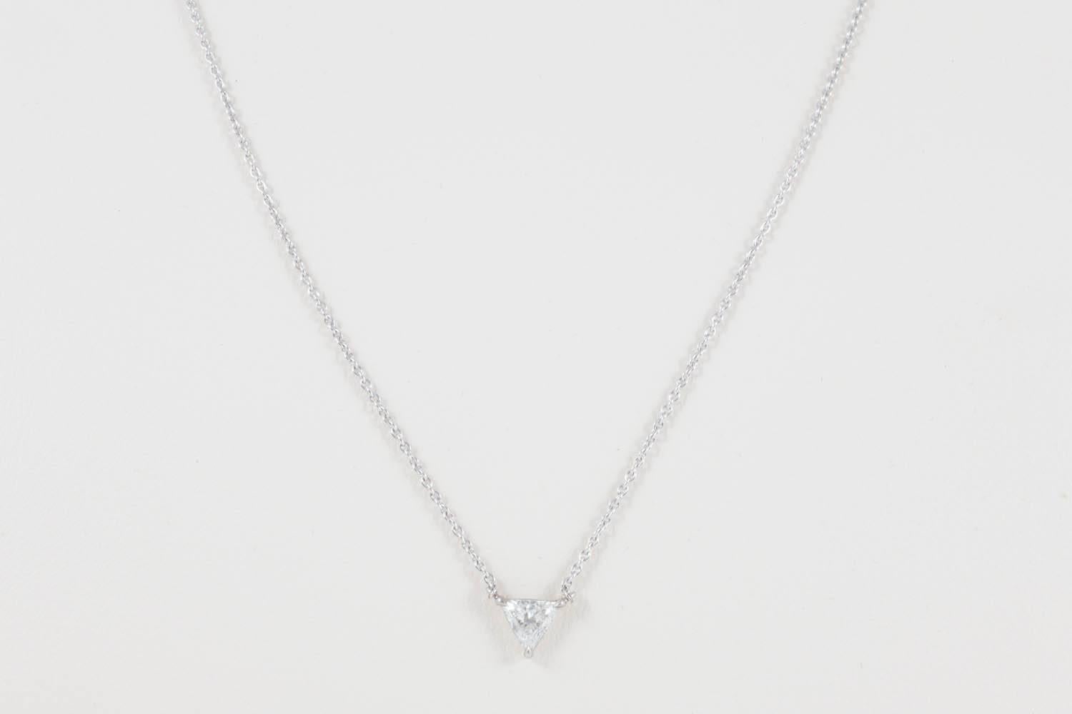 The trilliant cut diamond weighs approximately a third of a carat and is of H colour and VS2 clarity - it is beautifully mounted in 18ct white gold with a fine trace chain and high quality clasp. 