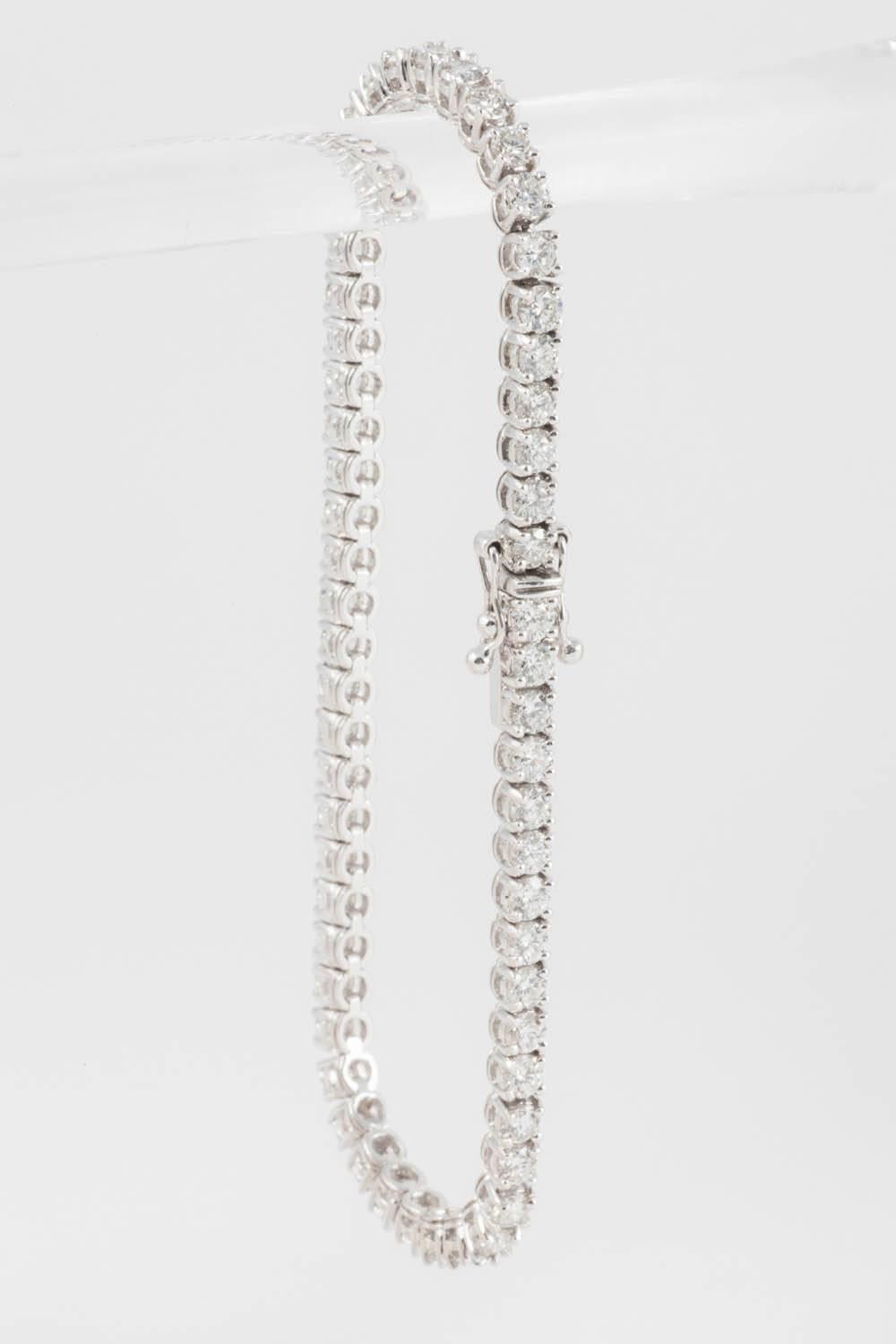 A classic diamond line bracelet composed of approximately 5.85 carats of Premium cut round brilliant cut diamonds set to a classic 4 claw mounting in 18ct white gold. The diamonds are all finely cut and are of "G" Rare White + colour and