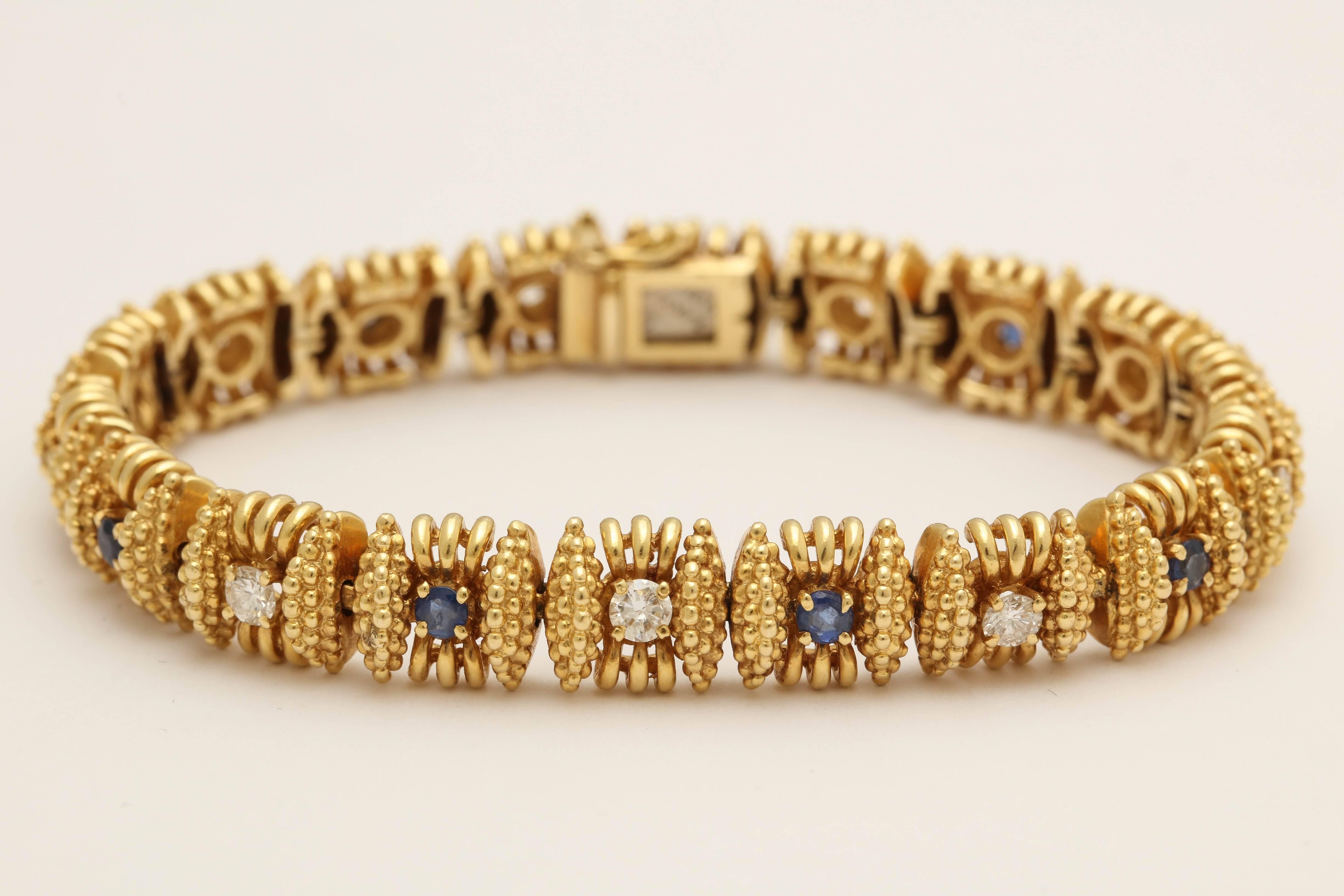 One Ladies 18kt Rich Yellow Gold Bracelet Designed with Alternating Full Cut Diamonds and With Alternating Beautiful Color Faceted Sapphires. weight Of Diamonds Approximately .90 Cts And weight Of Sapphires Approximately .75 Cts Total Weight.