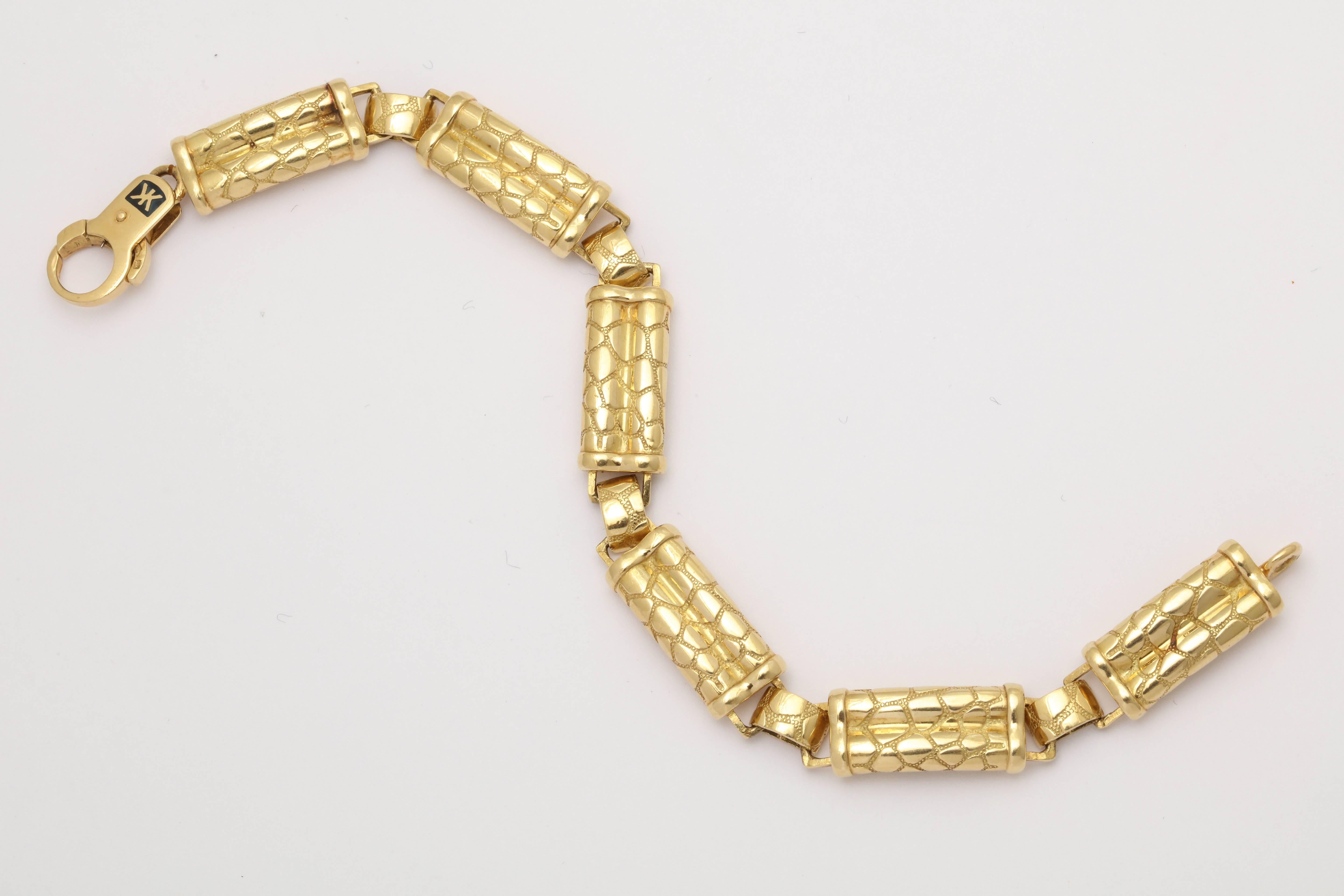 One Unisex Flexible Link Bracelet Created In A High Intense Bright Color 18kt Yellow Gold Reptile Design.Each Link Is Created In A Double Barrel Motif Connected By An Oblong Smaller Three Dimensional Link. All Links Designed In A Beautiful reptile