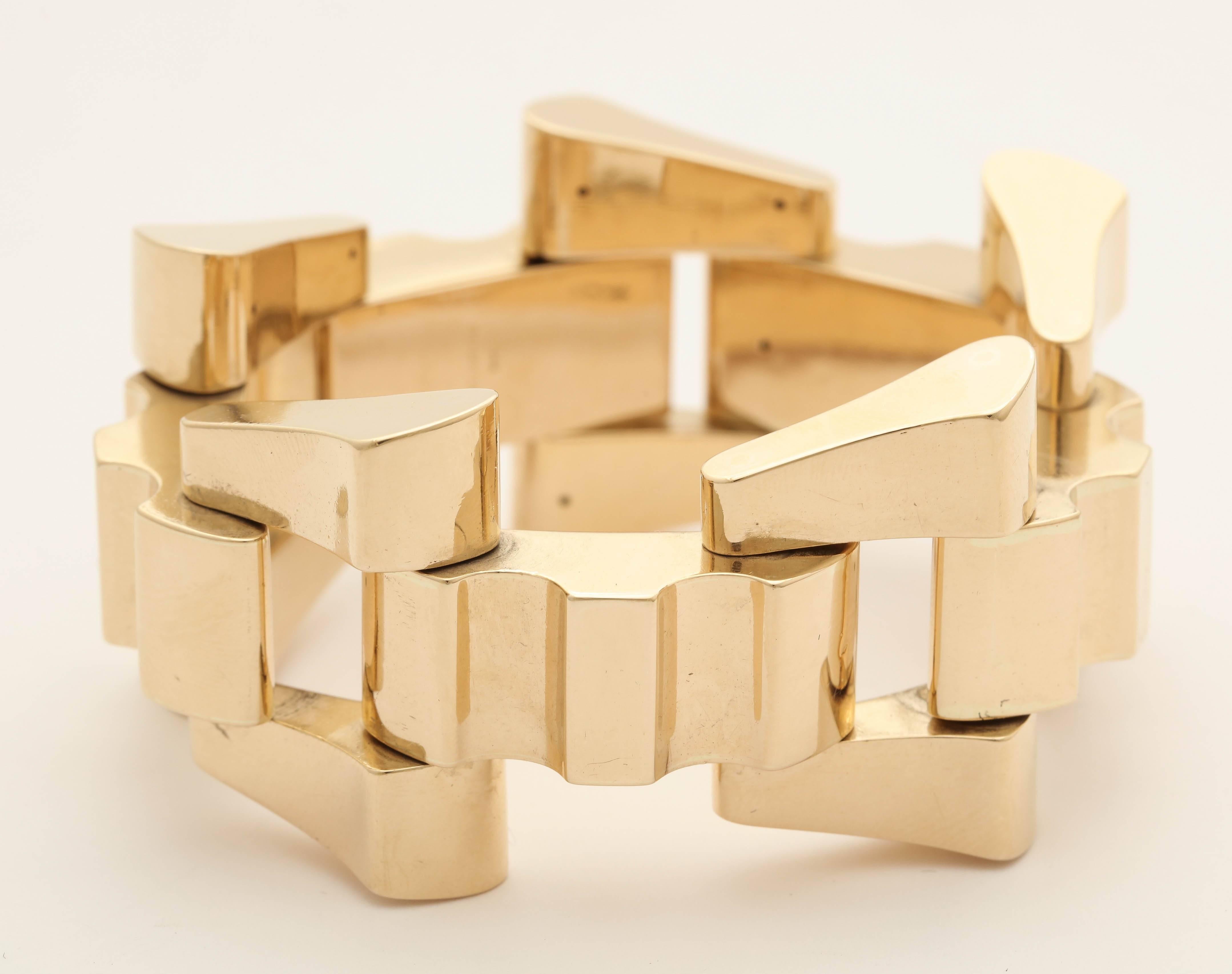 One Ladies Architectural And Flexible High Polish 14kt Yellow Gold Open Link Geometric Bracelet Designed For The Contemporary And Chic Woman. This Bracelet Is The Perfect Fit For An Everyday Wear And Goes With Every Attire And Fits Into a Dressy Or